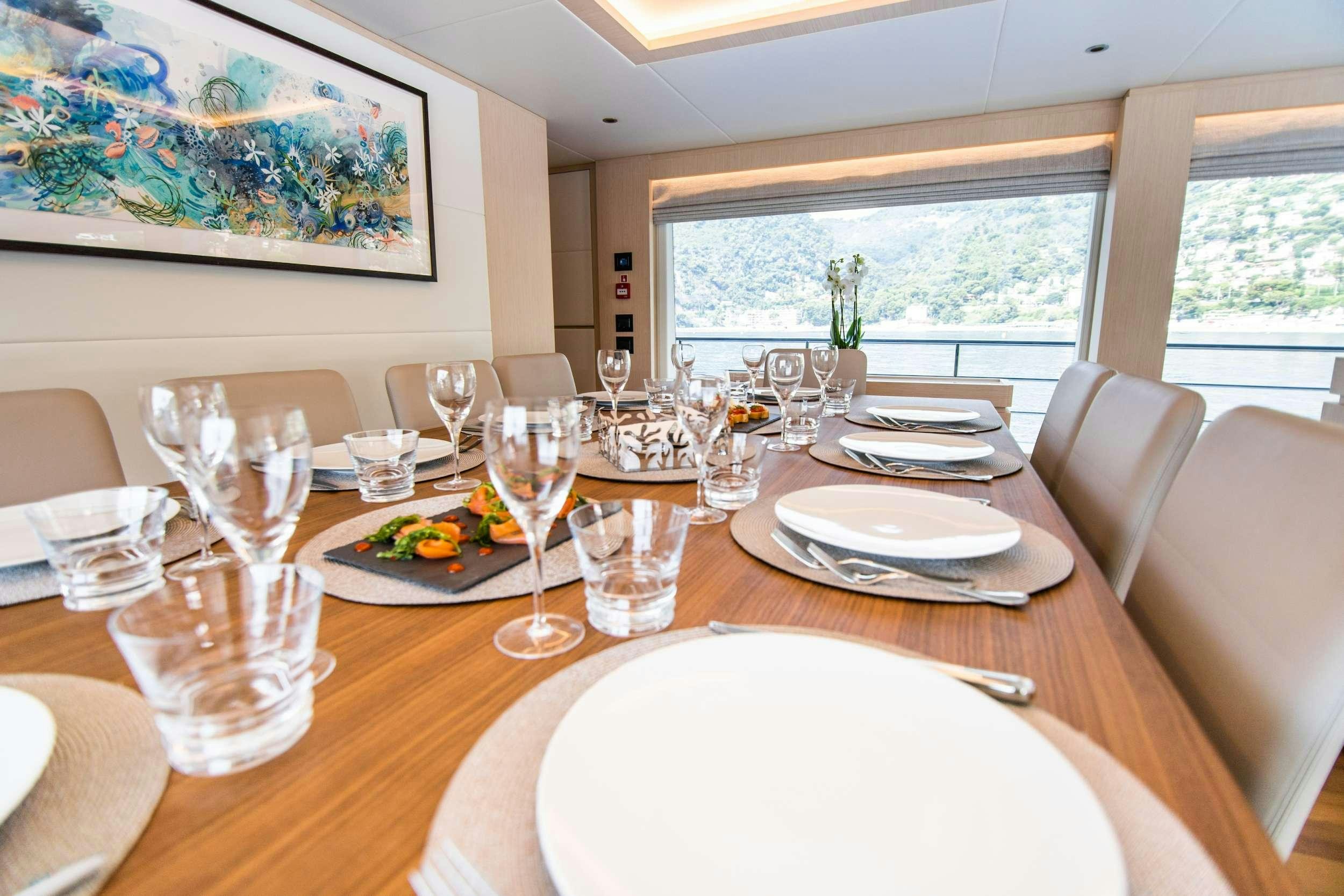 a table with plates and glasses on it aboard OCEAN VIEW Yacht for Charter