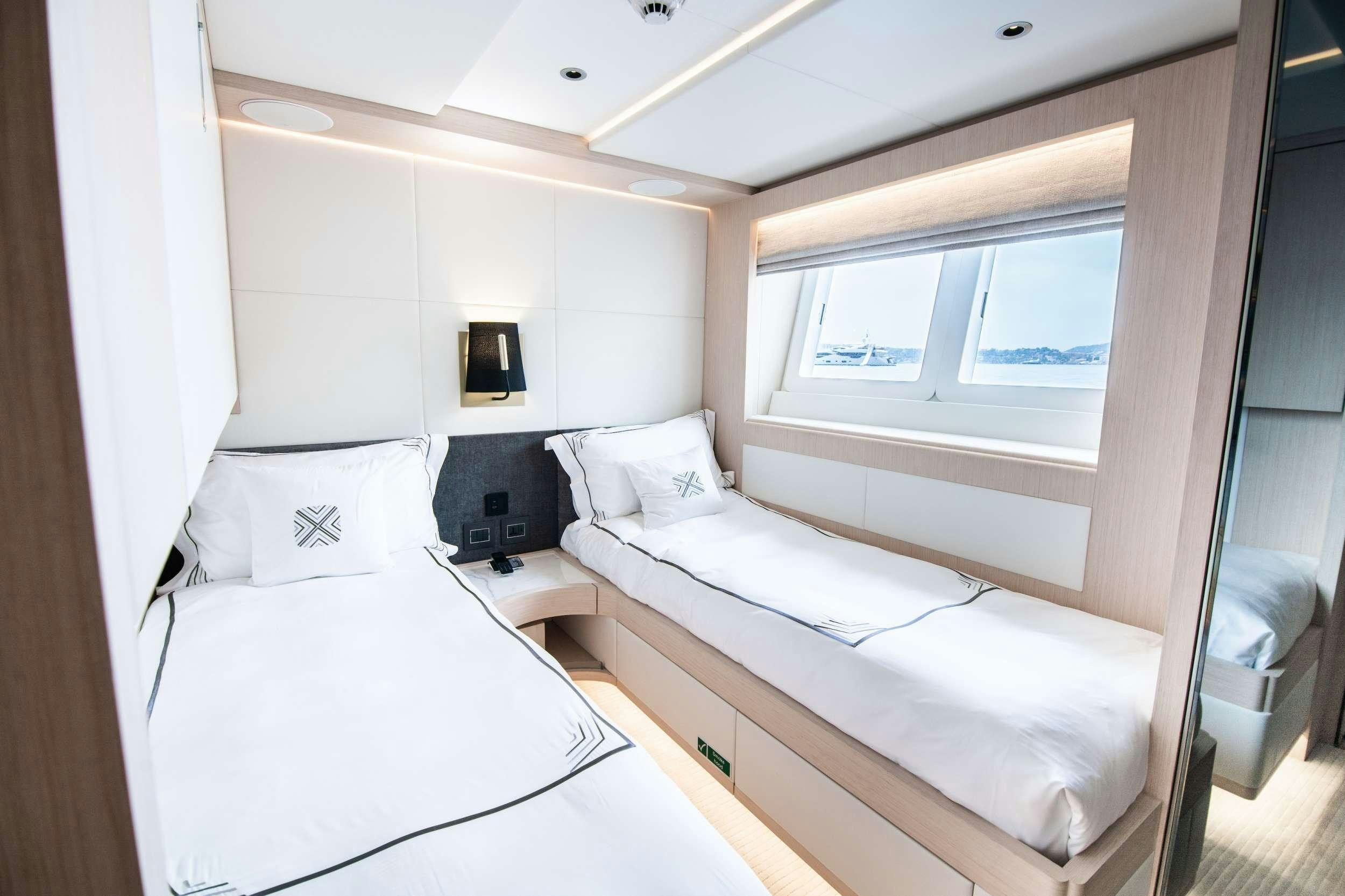 a room with two beds aboard OCEAN VIEW Yacht for Charter