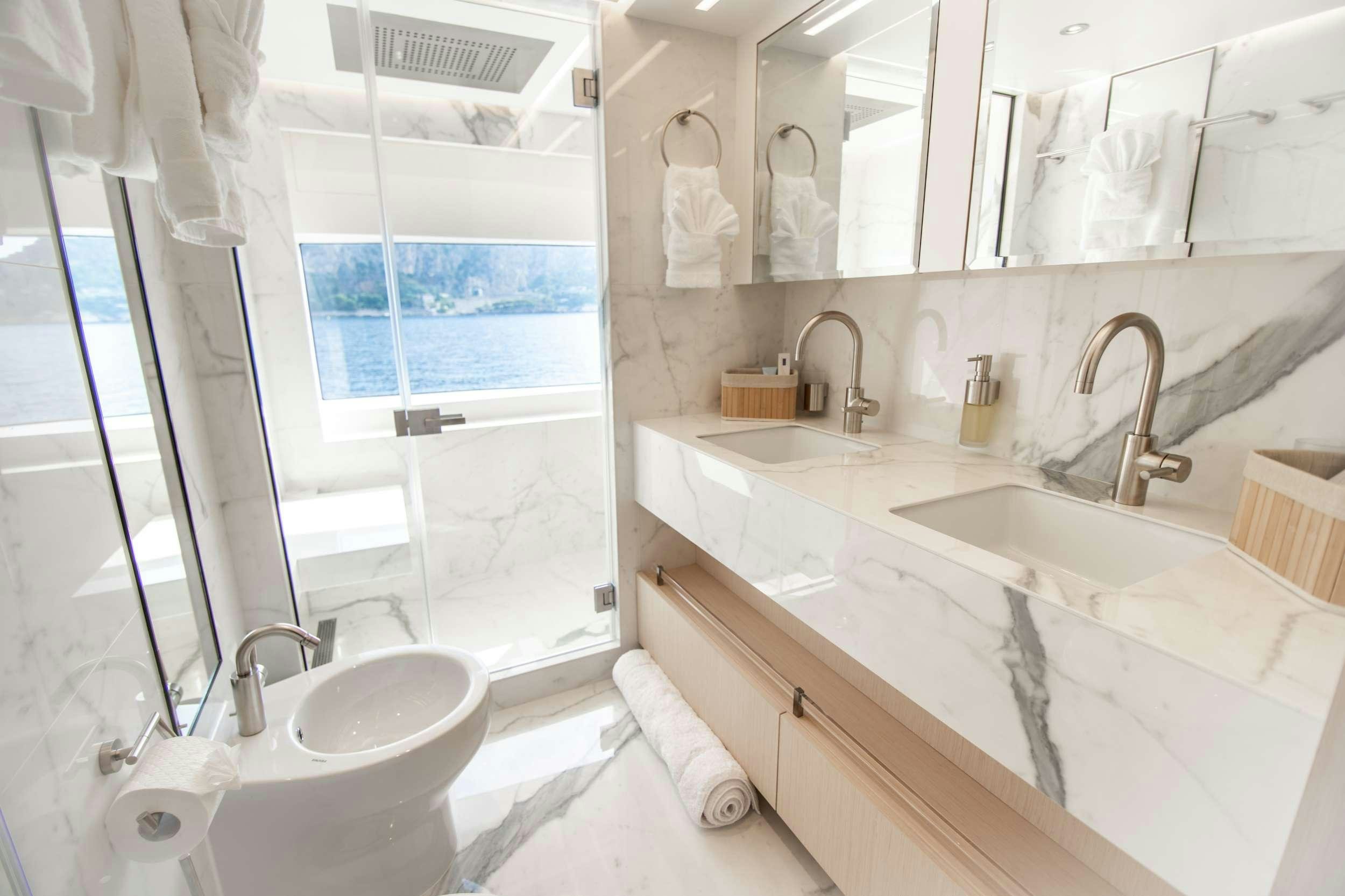 a bathroom with a sink and a bathtub aboard OCEAN VIEW Yacht for Charter