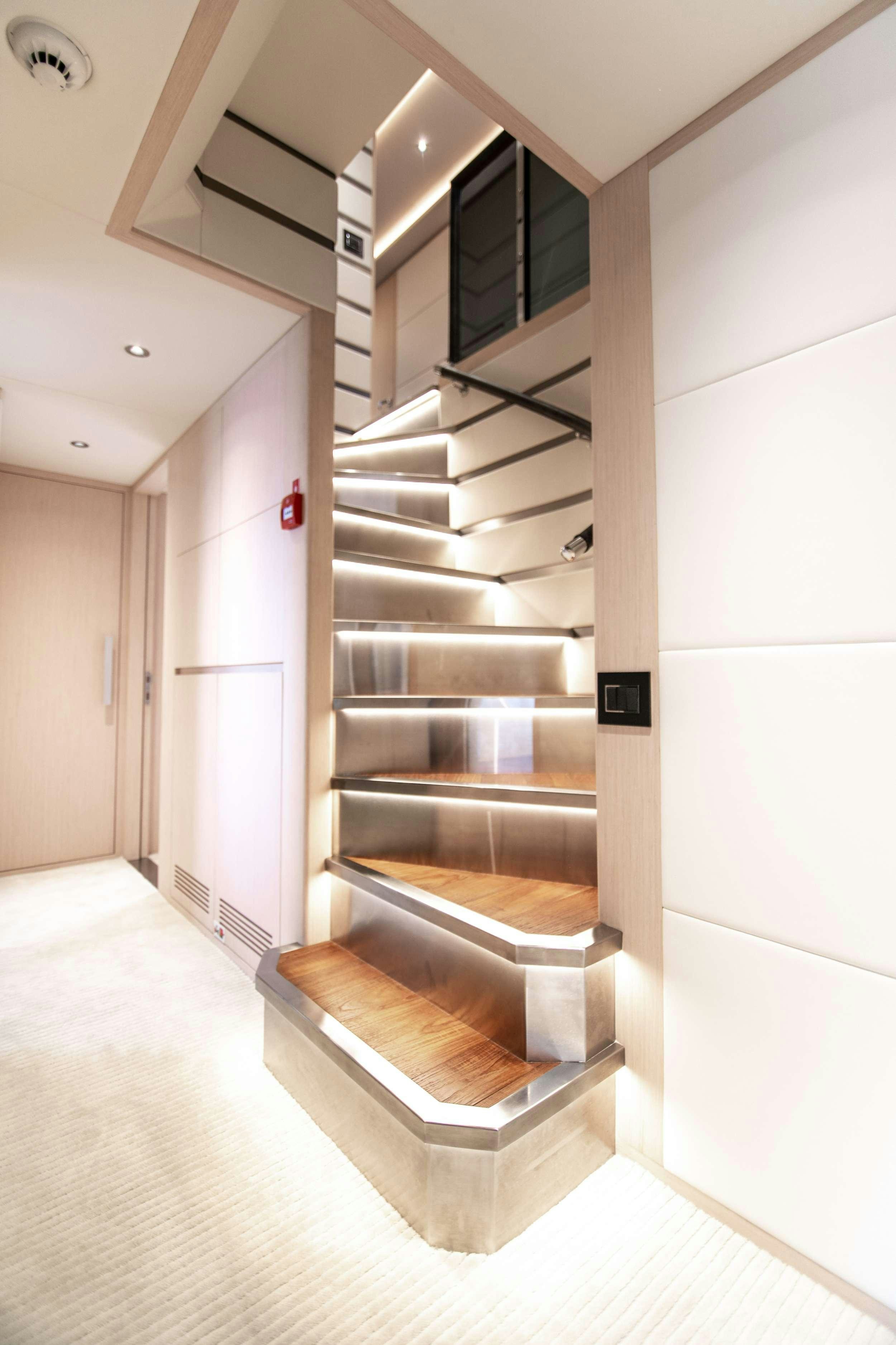 a wooden staircase in a house aboard OCEAN VIEW Yacht for Charter