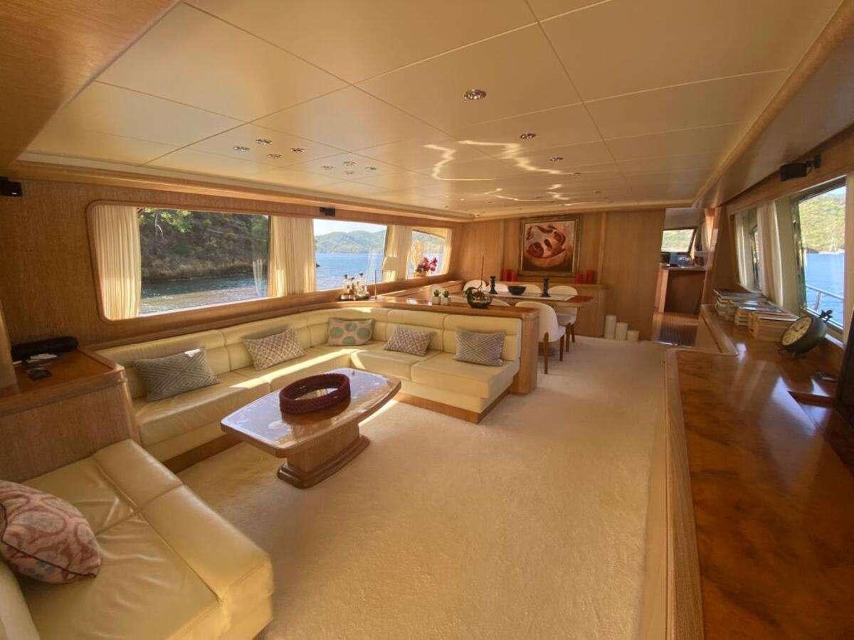 a living room with a couch and a table aboard BORAM Yacht for Charter