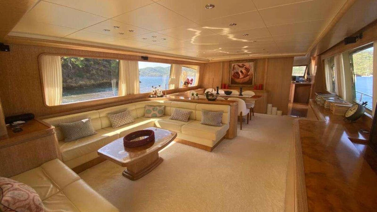 a living room with a couch and a table aboard BORAM Yacht for Charter