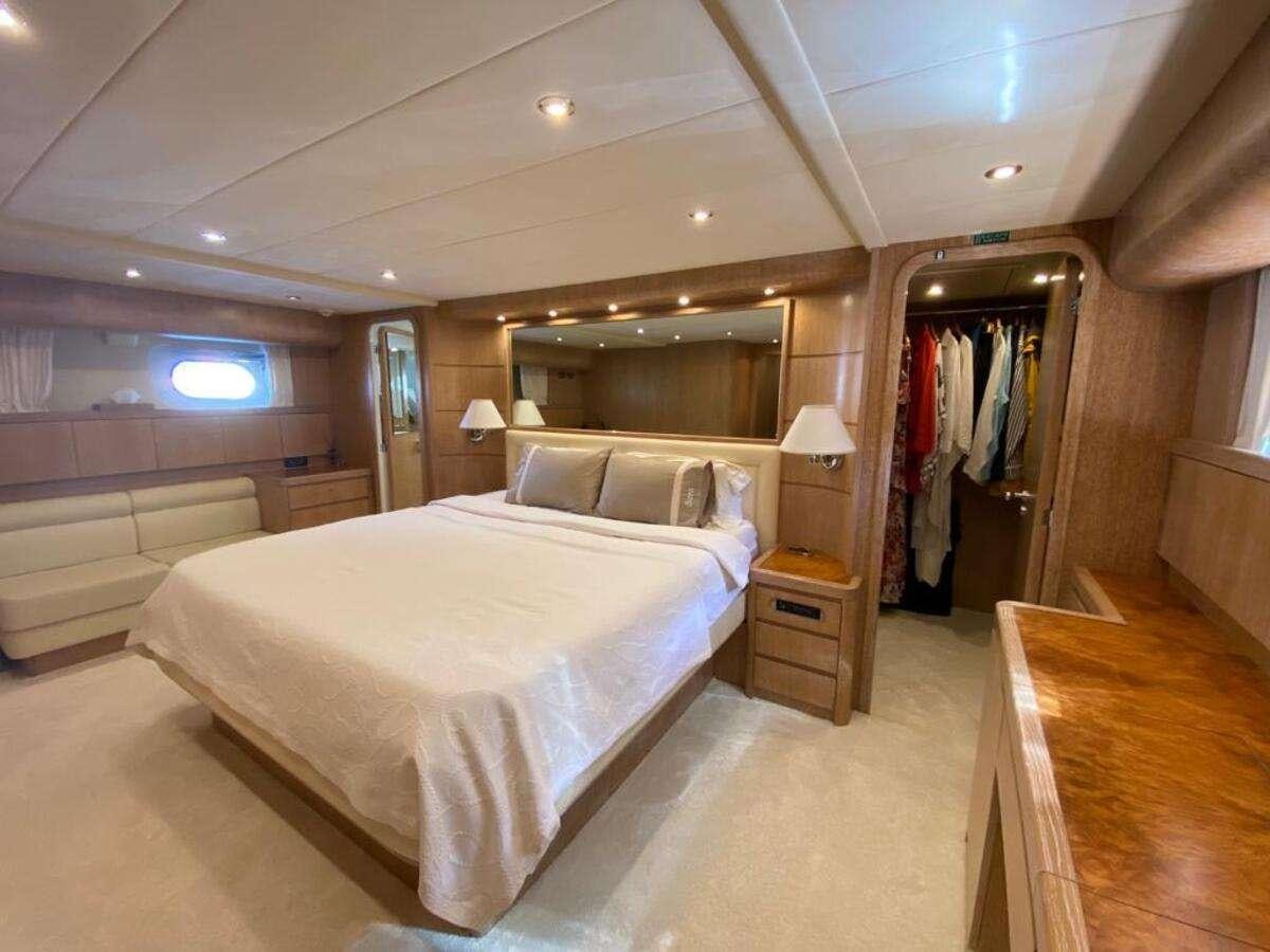 a room with a bed and a closet aboard BORAM Yacht for Charter