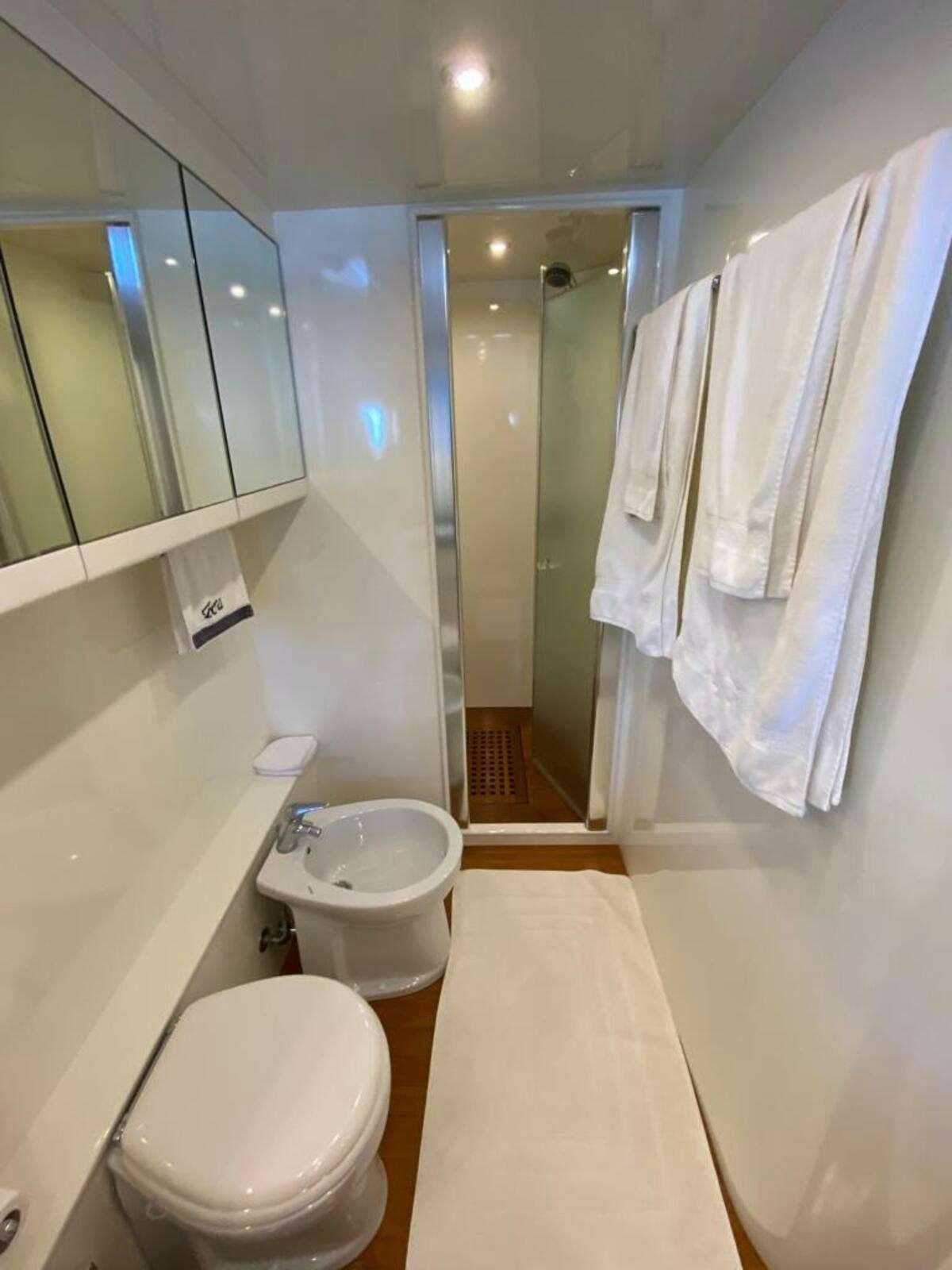 a bathroom with a toilet and a sink aboard BORAM Yacht for Charter