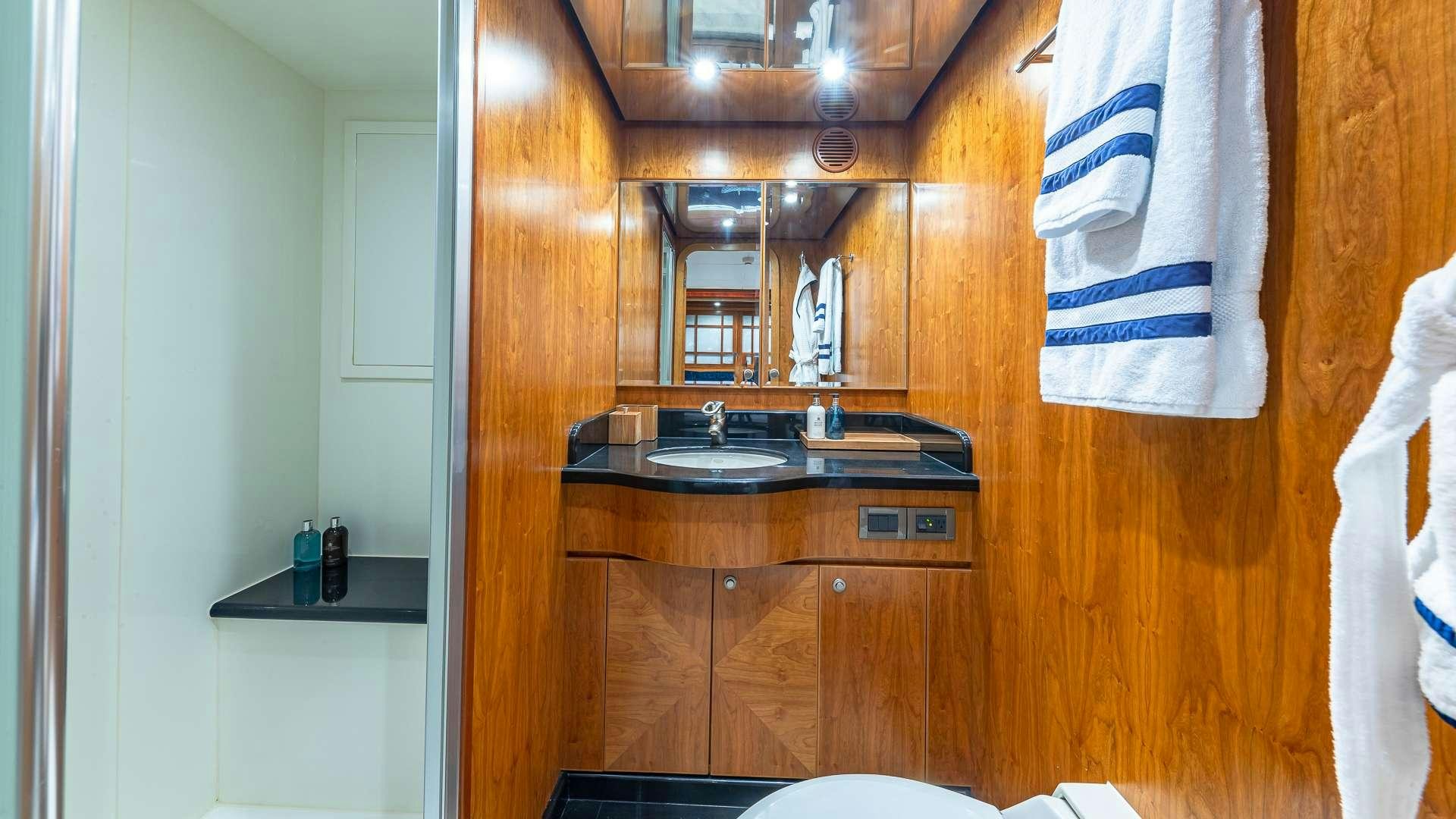 a kitchen with a sink and a mirror aboard B HAPPY Yacht for Charter