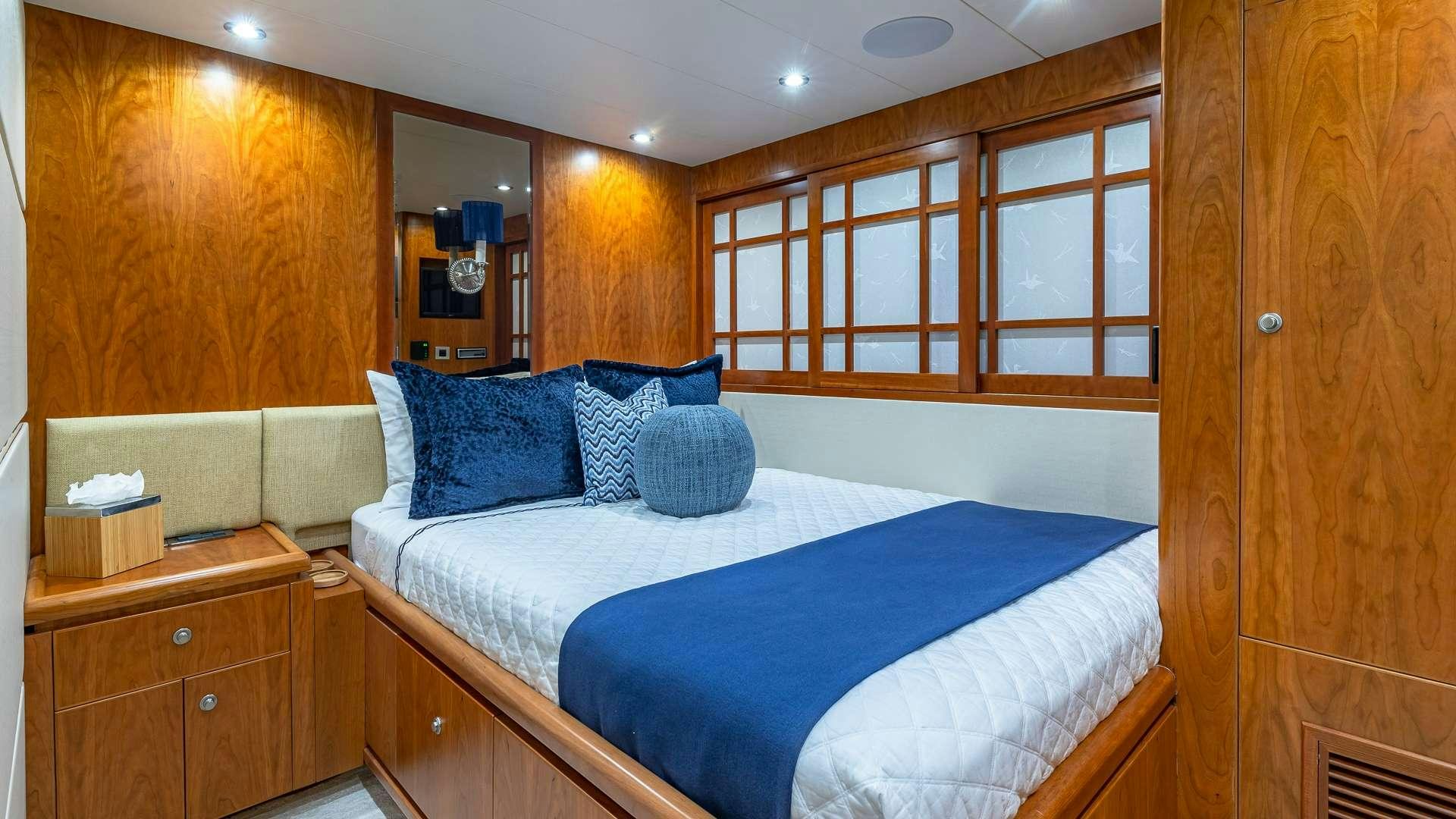 a bed in a room aboard B HAPPY Yacht for Charter