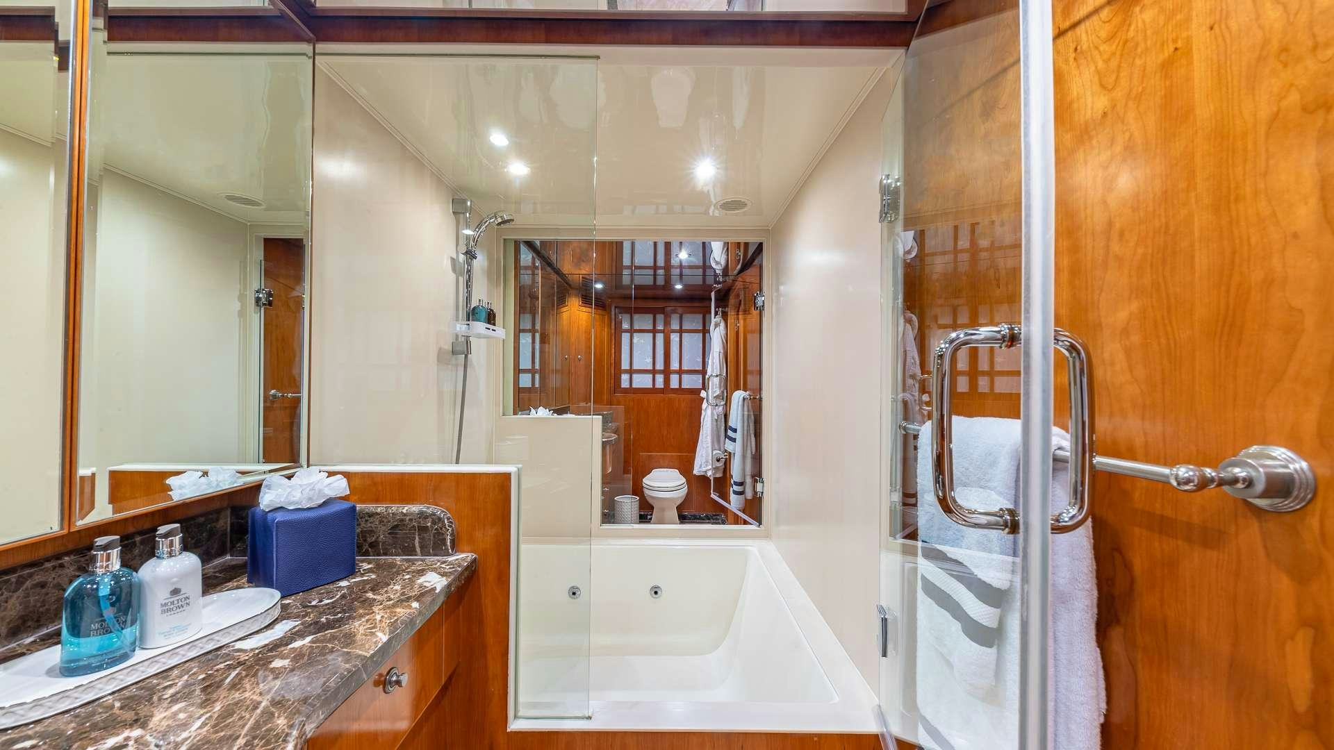 a bathroom with a shower and sink aboard B HAPPY Yacht for Charter