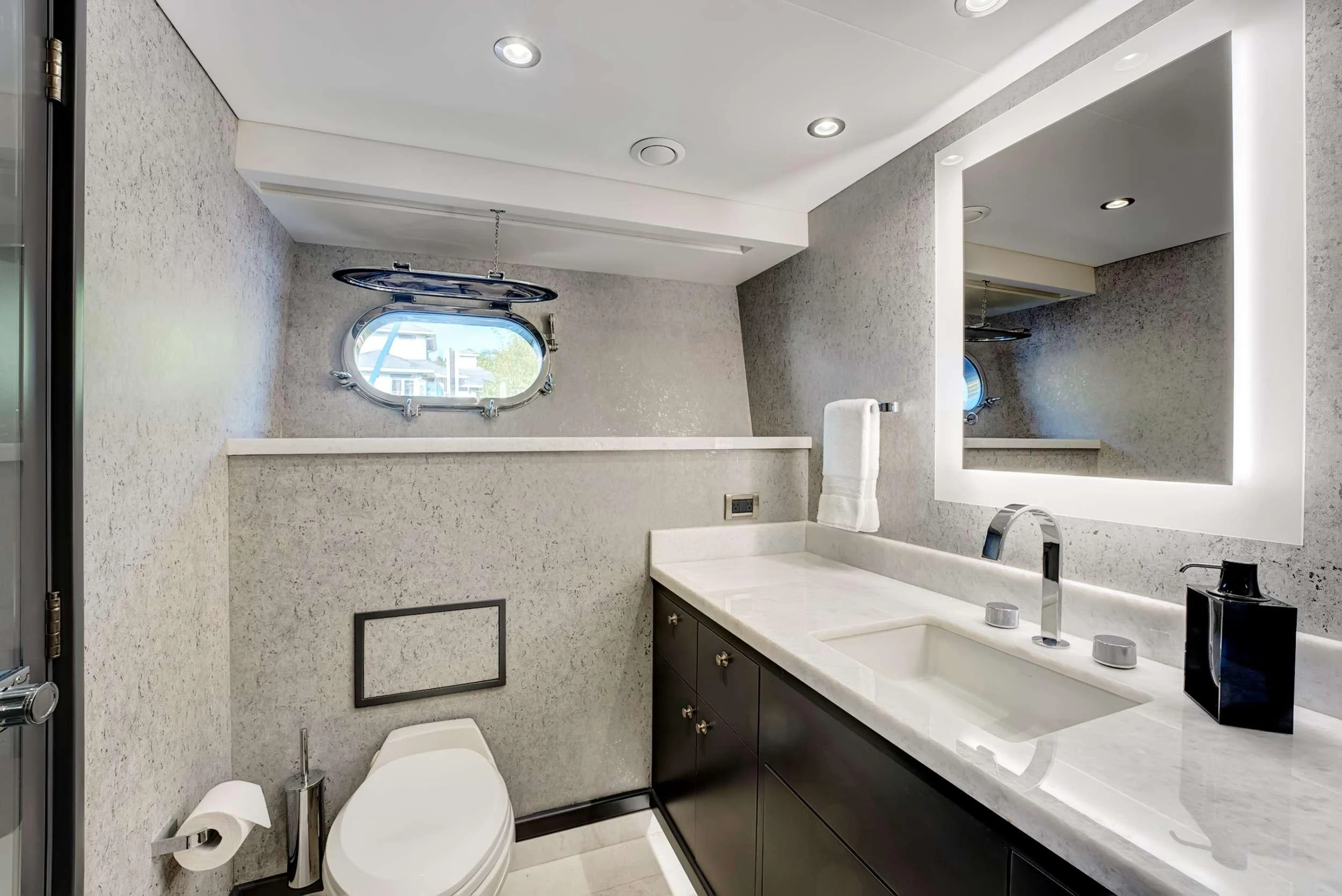 a bathroom with a sink and a toilet aboard MAS GRANDE Yacht for Charter