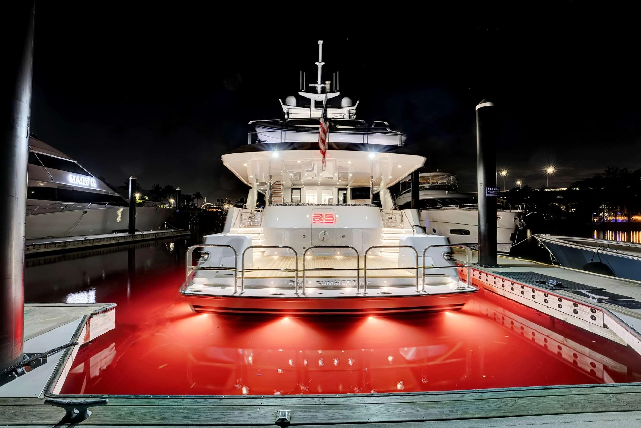 a large boat in a harbor aboard MAS GRANDE Yacht for Charter
