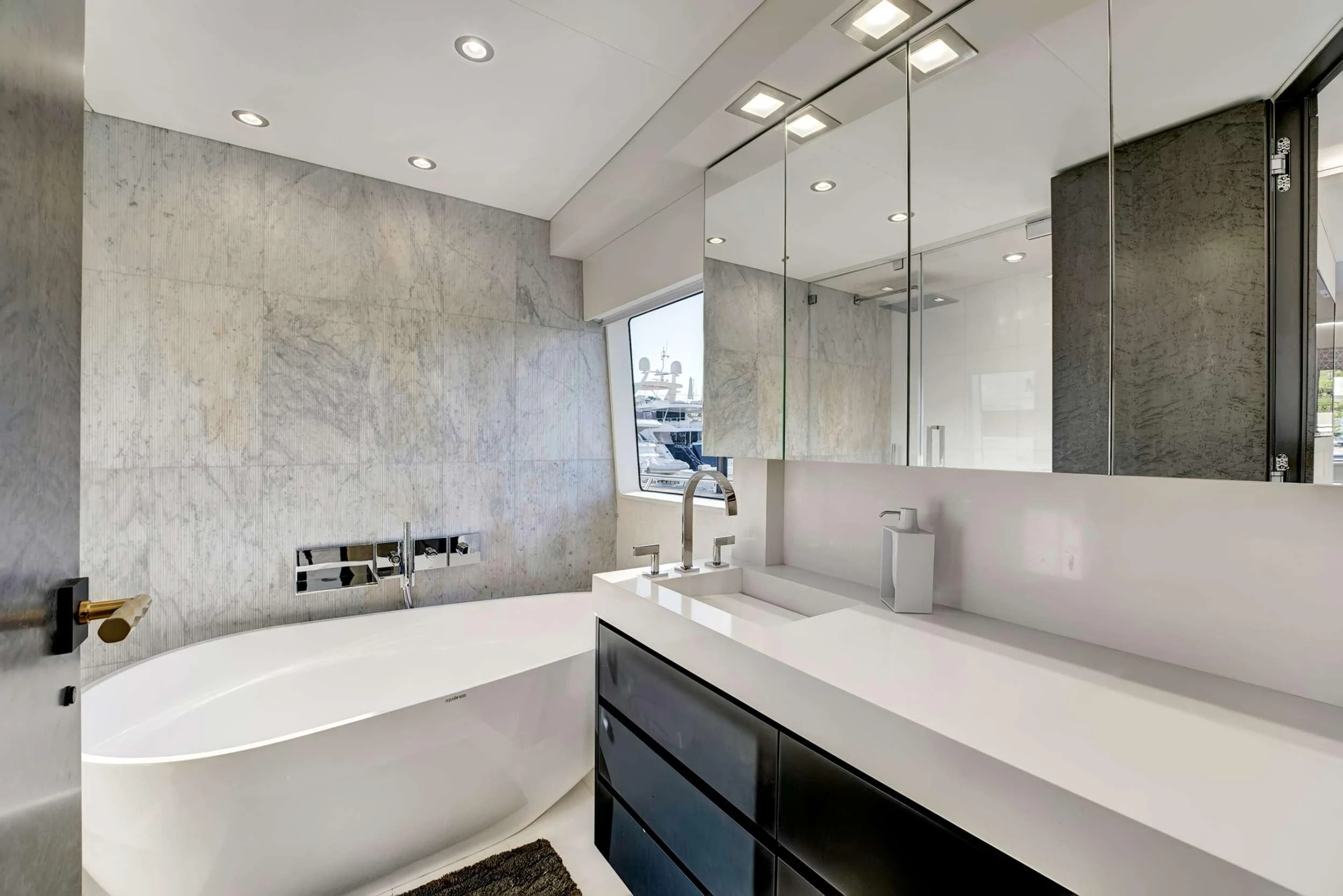 a bathroom with a large mirror aboard MAS GRANDE Yacht for Charter