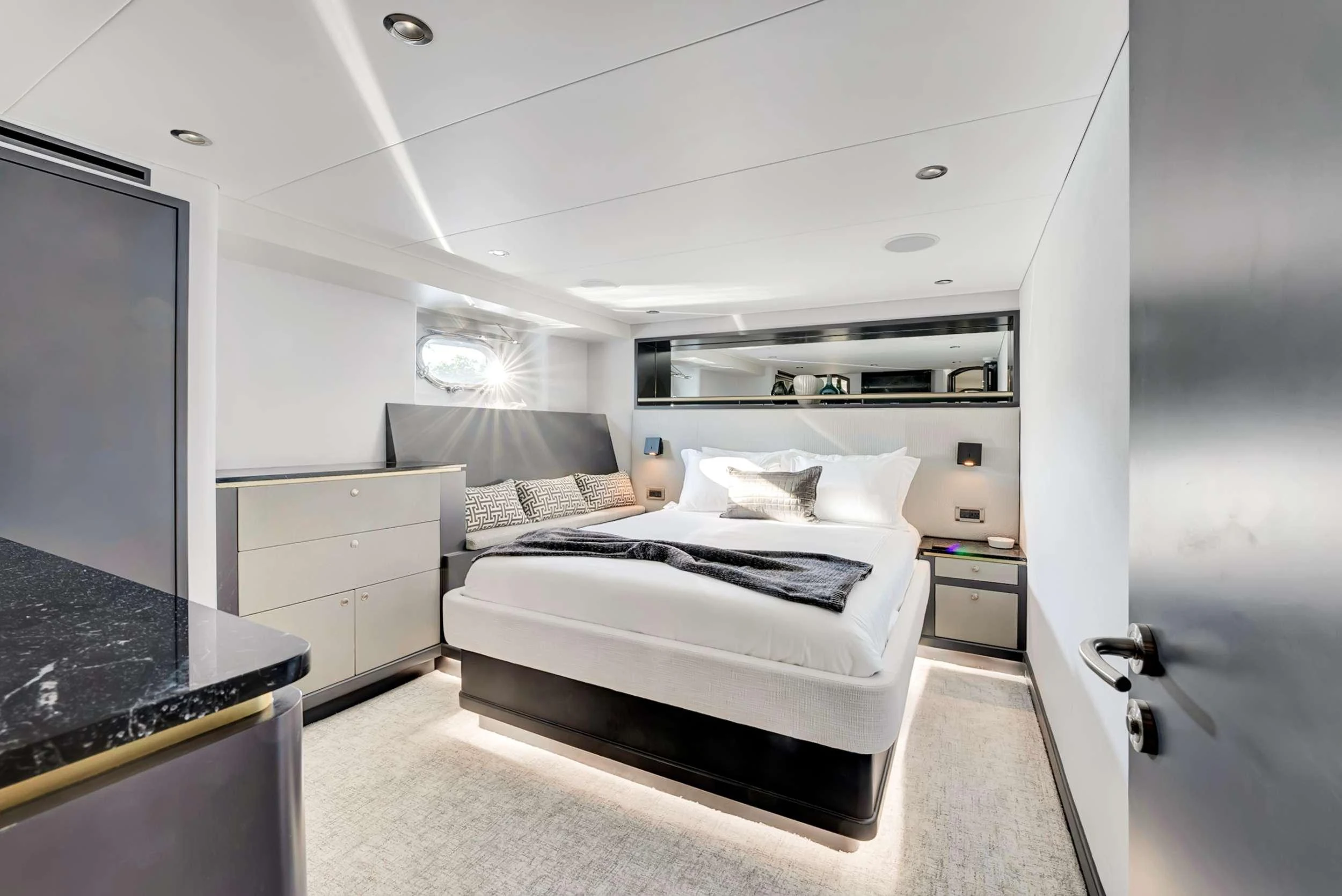 a bedroom with a bed aboard MAS GRANDE Yacht for Charter