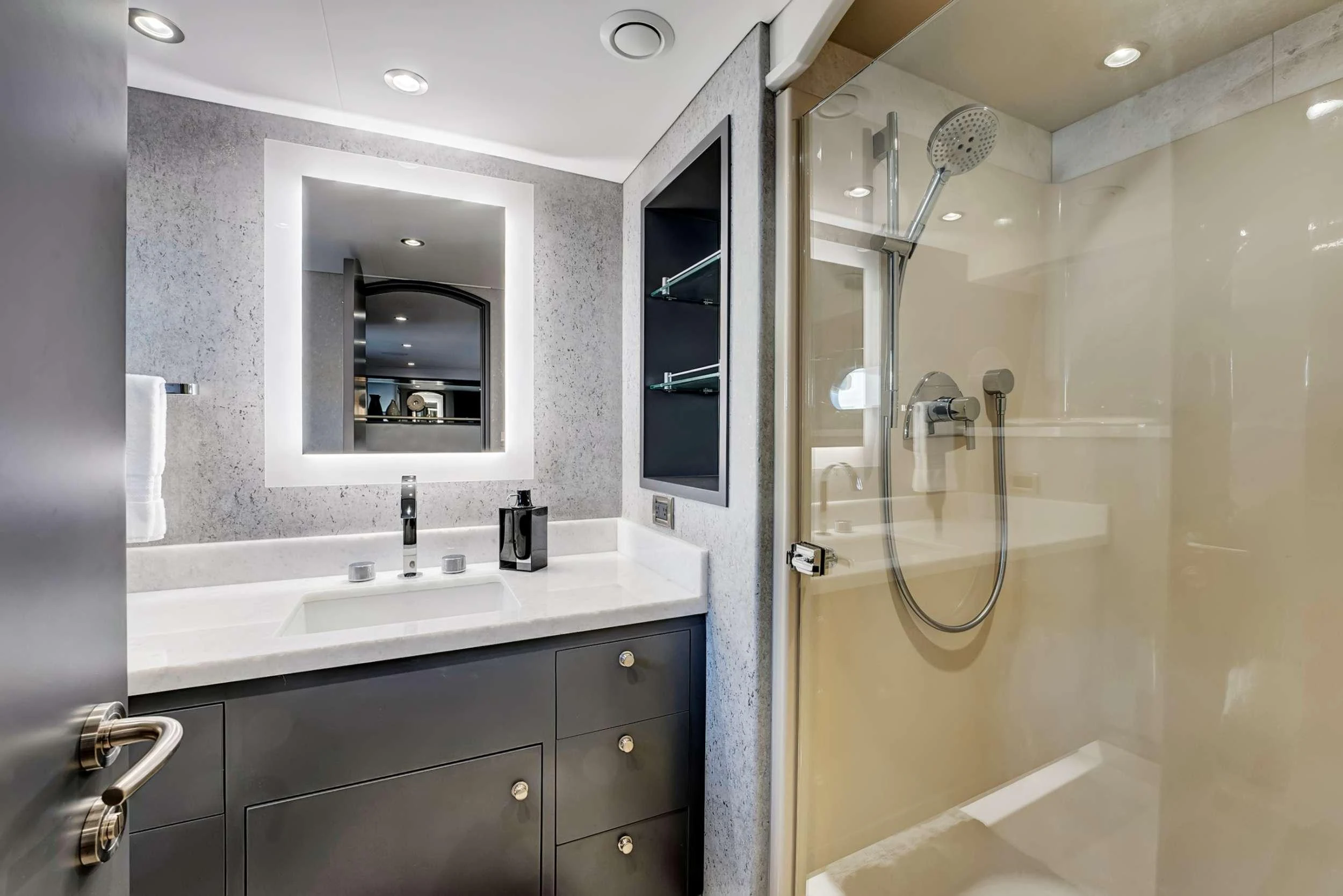 a bathroom with a large mirror aboard MAS GRANDE Yacht for Charter