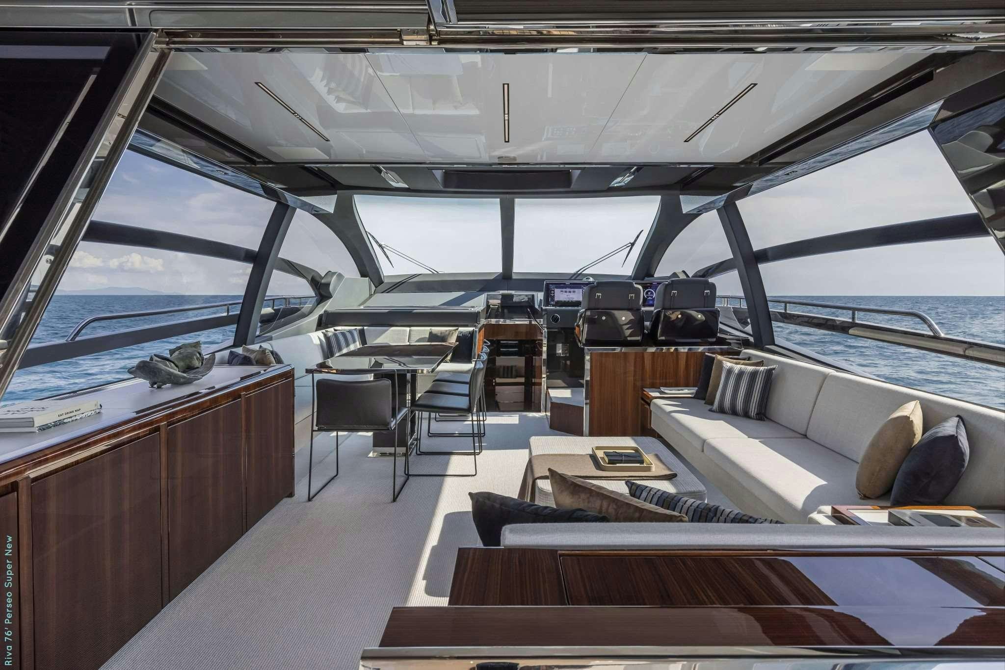 a boat with a couch and a table aboard RECREATIONAL USE Yacht for Charter