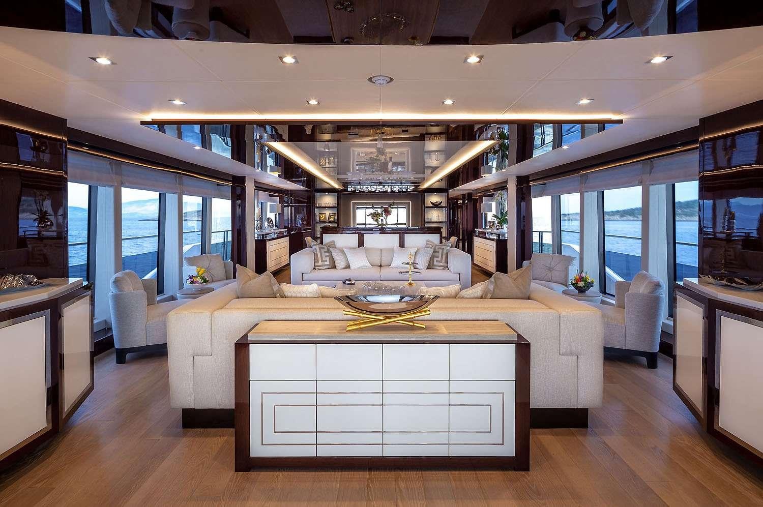 a living room with a large window aboard AQUA LIBRA Yacht for Charter