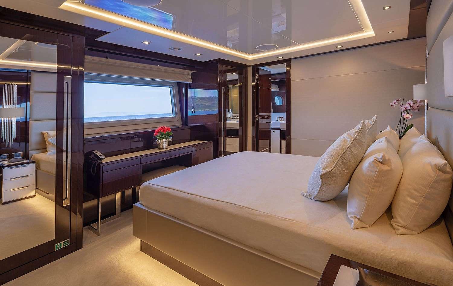 a room with a couch and a tv aboard AQUA LIBRA Yacht for Charter