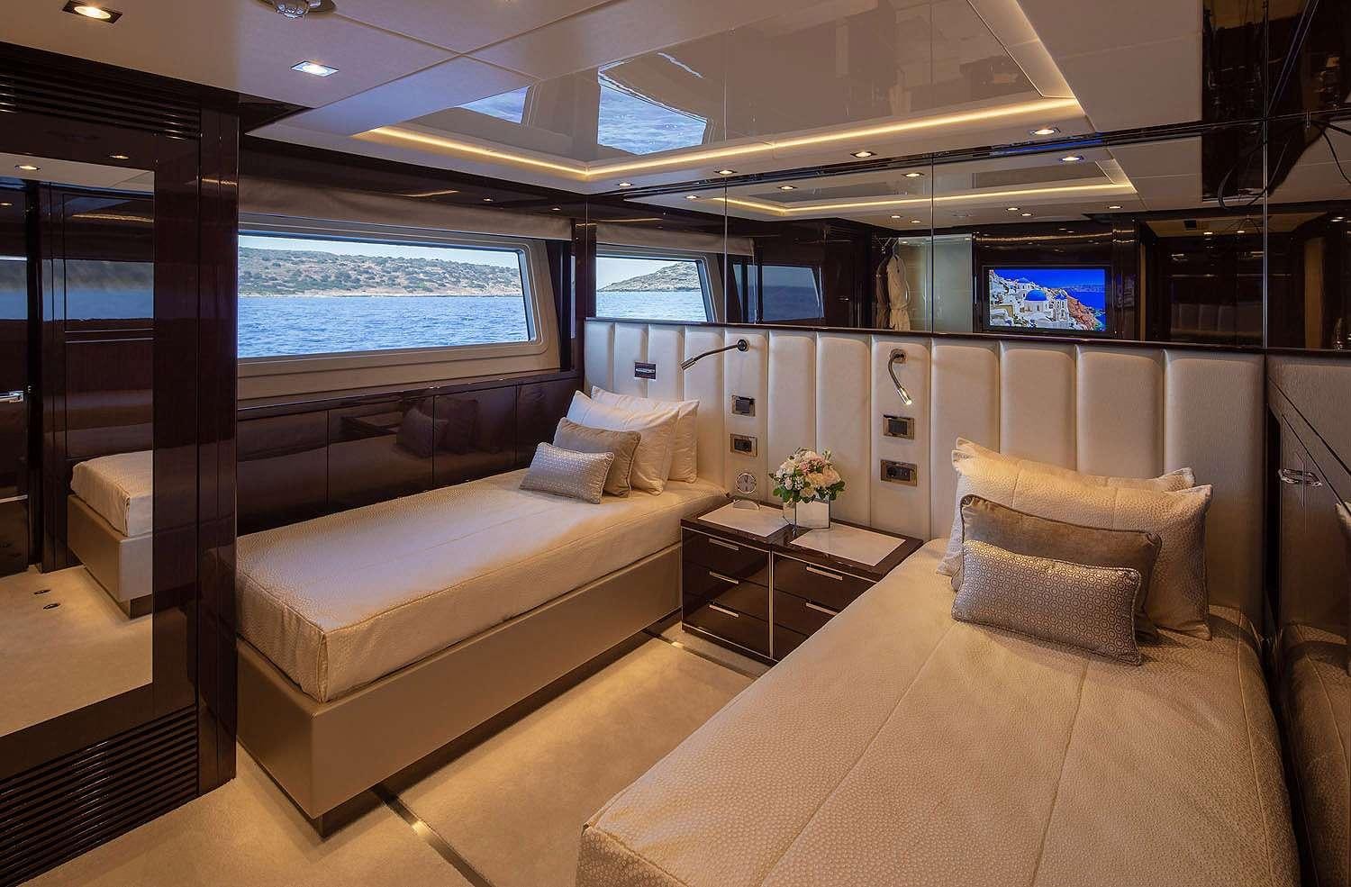 a room with a couch and a tv aboard AQUA LIBRA Yacht for Charter