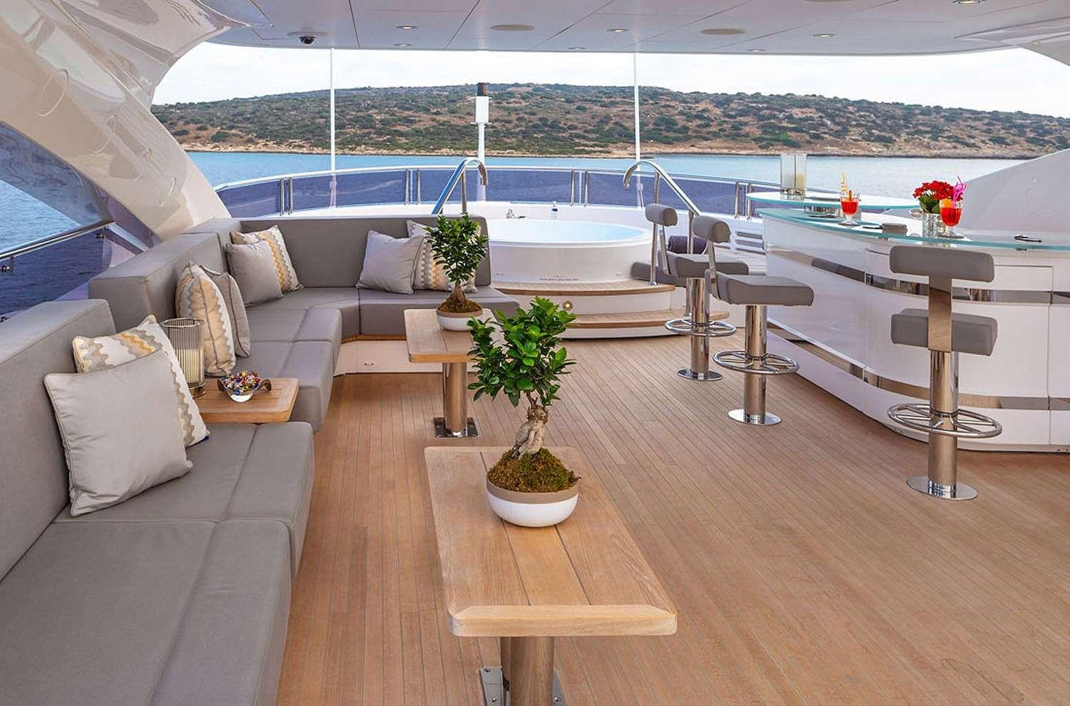 a room with a table and chairs aboard AQUA LIBRA Yacht for Charter