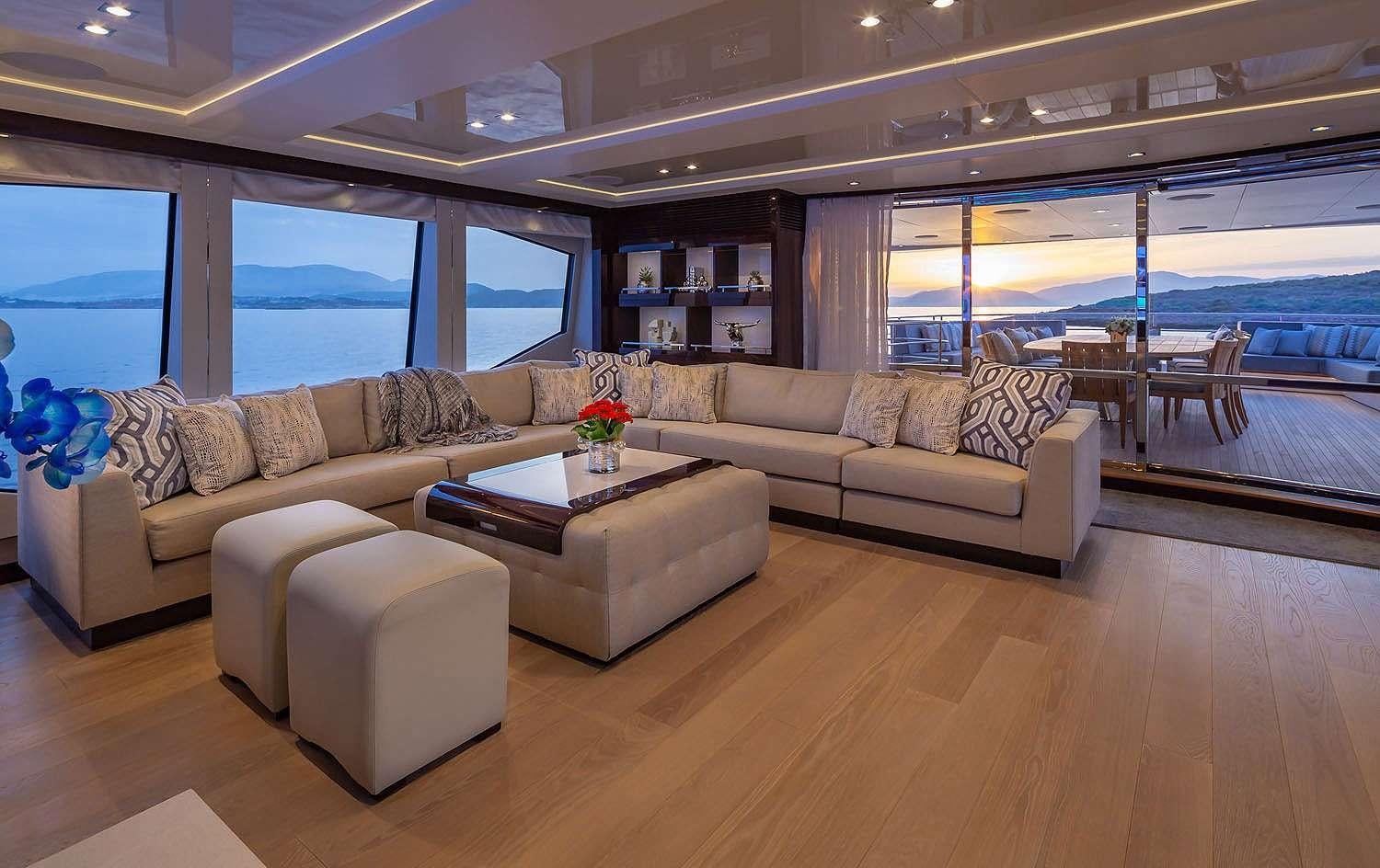 a living room with a couch and a table aboard AQUA LIBRA Yacht for Charter