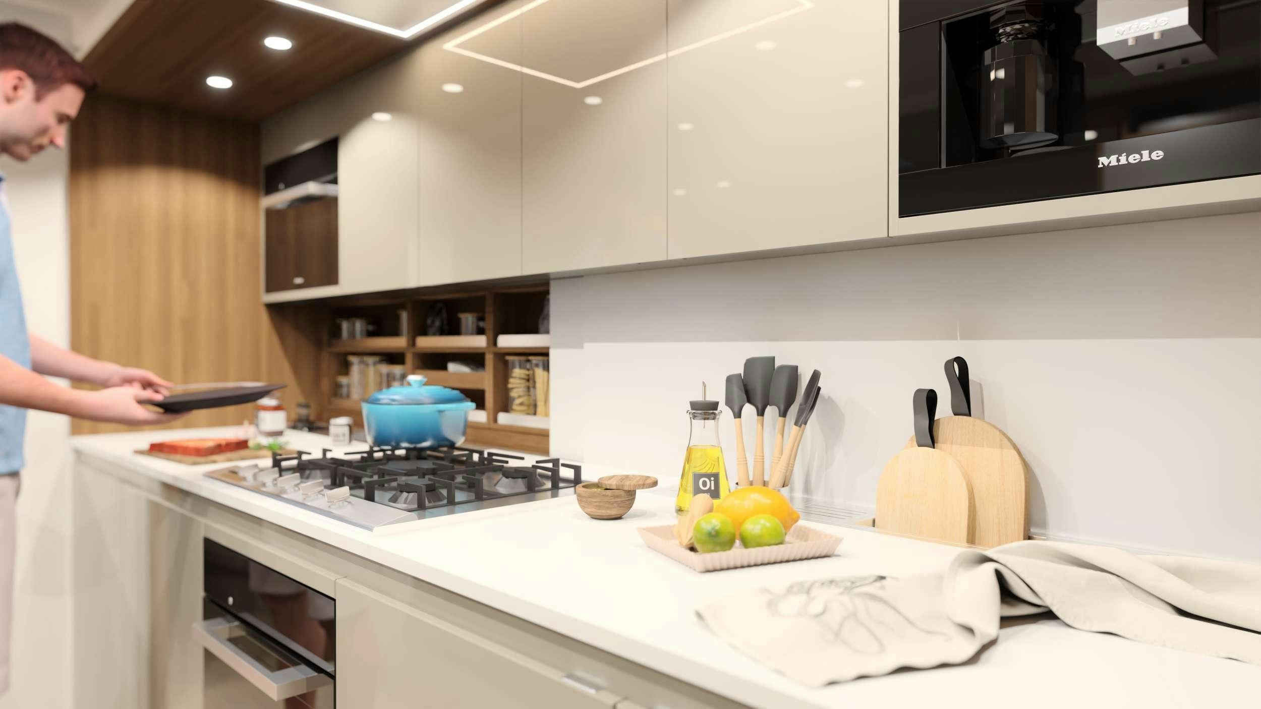 a person cooking in a kitchen aboard AD ASTRA 80 Yacht for Charter