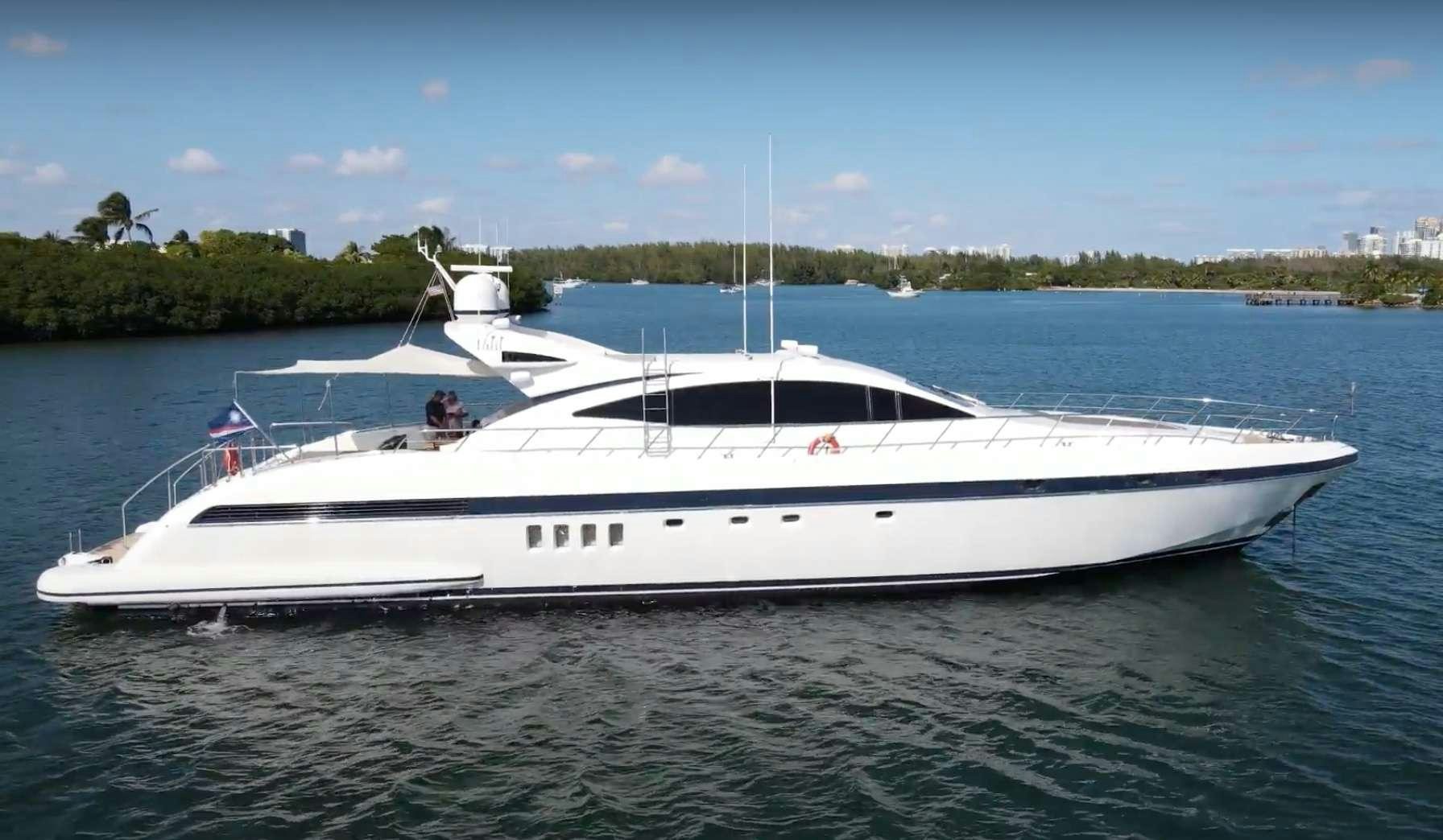 a white boat on the water aboard SMILE Yacht for Charter