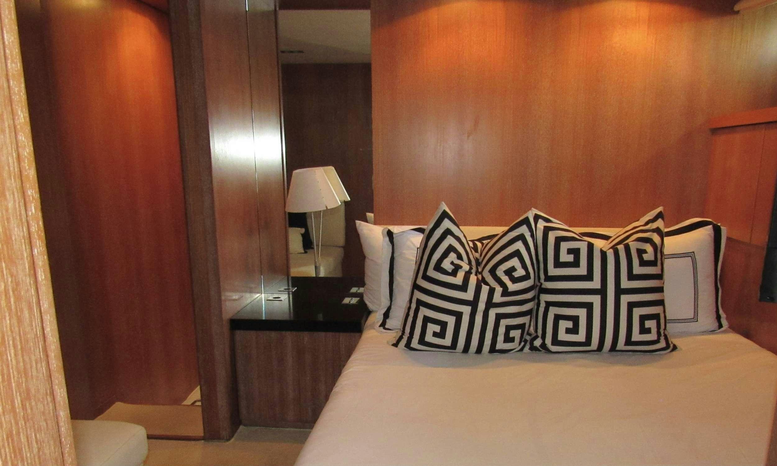 a hotel room with a bed aboard SMILE Yacht for Charter