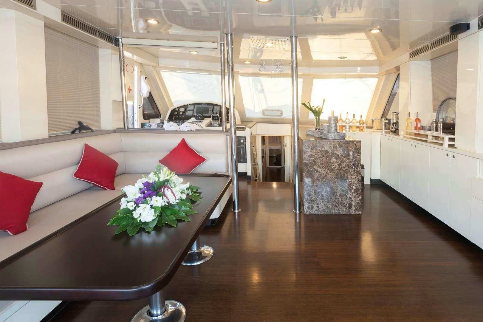 a living room with a couch and a table aboard SIYU Yacht for Charter