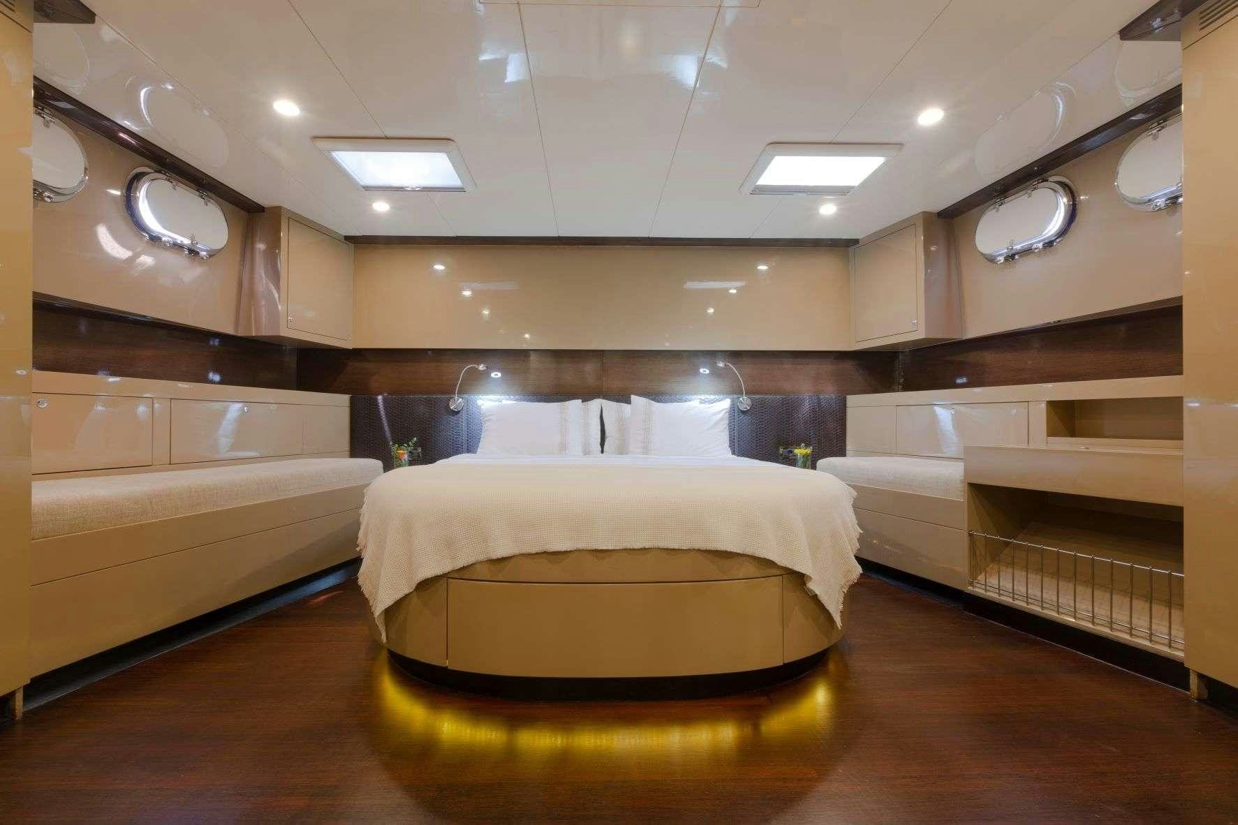 a large bed in a room aboard SIYU Yacht for Charter