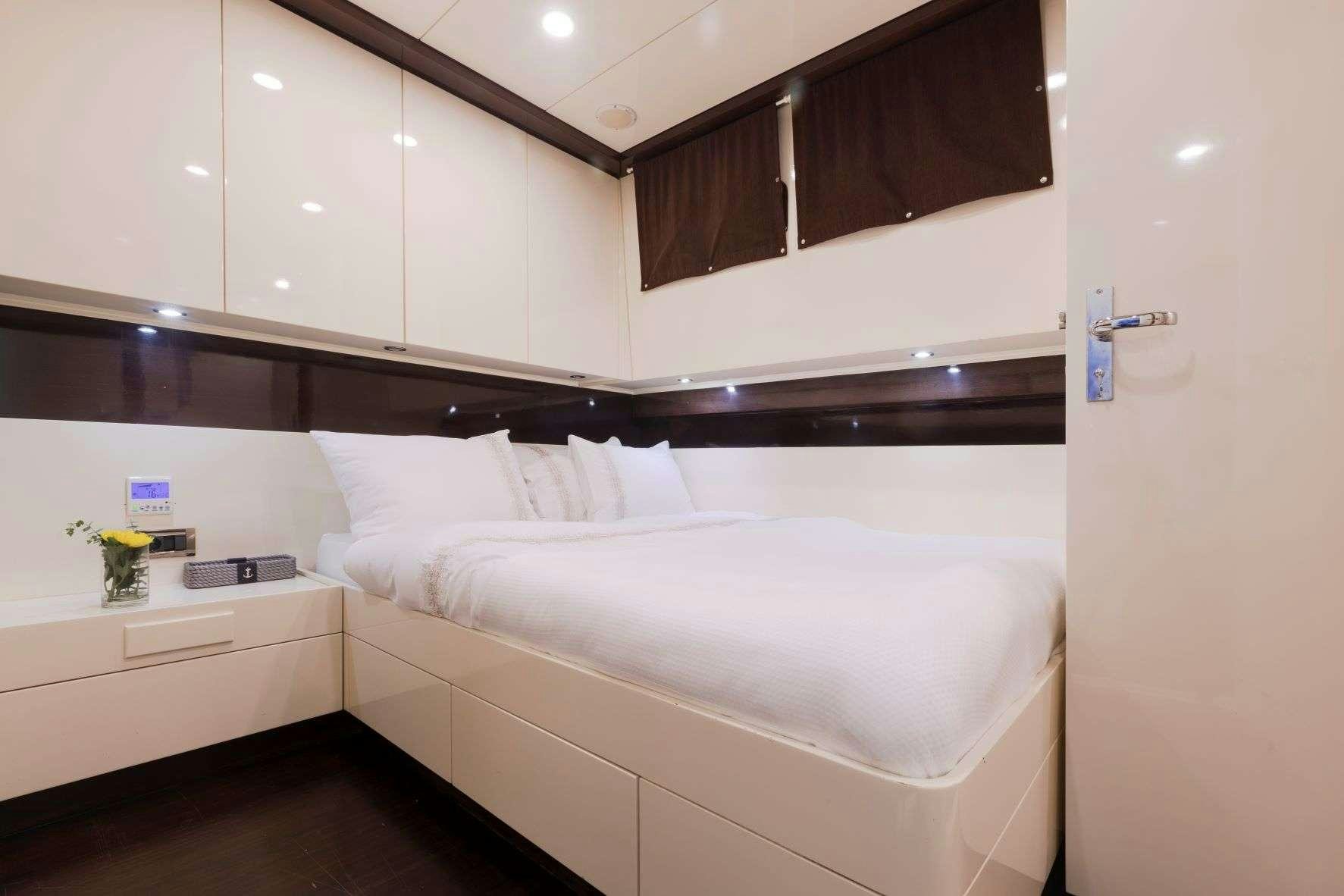 a bed in a room aboard SIYU Yacht for Charter