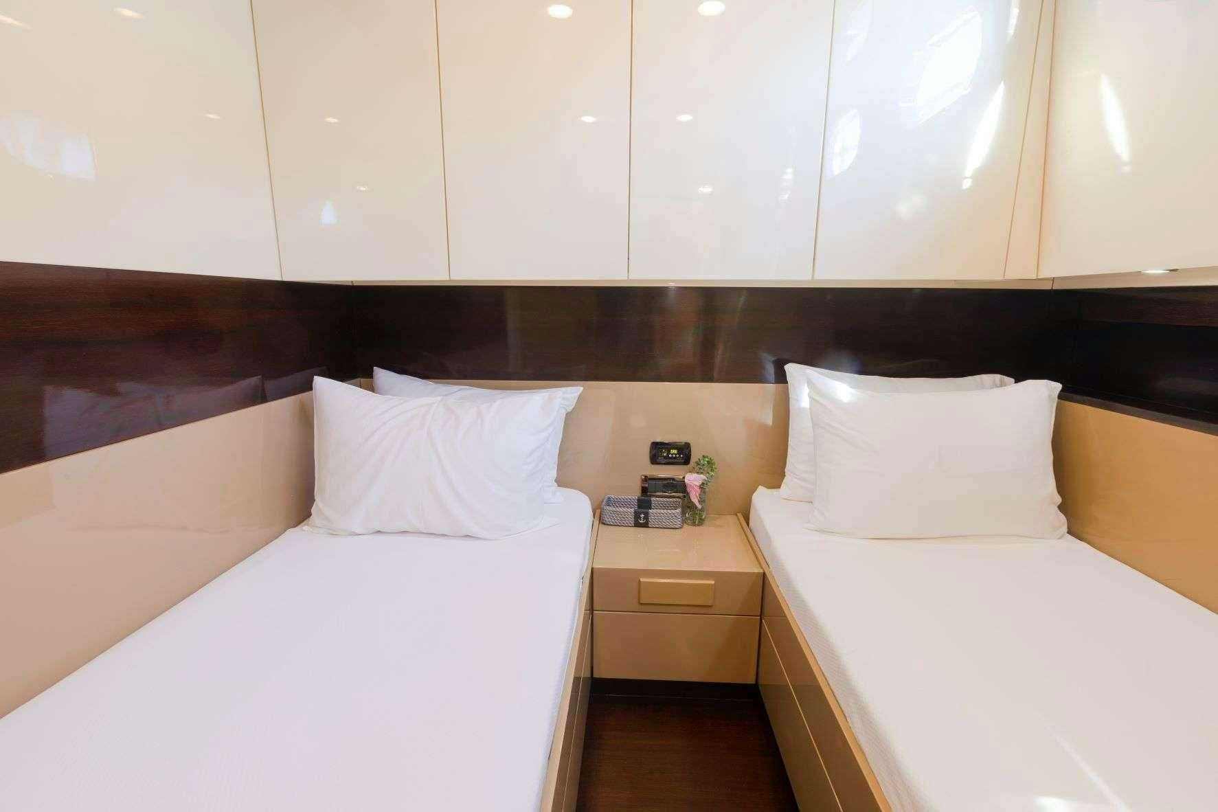 a room with two beds aboard SIYU Yacht for Charter