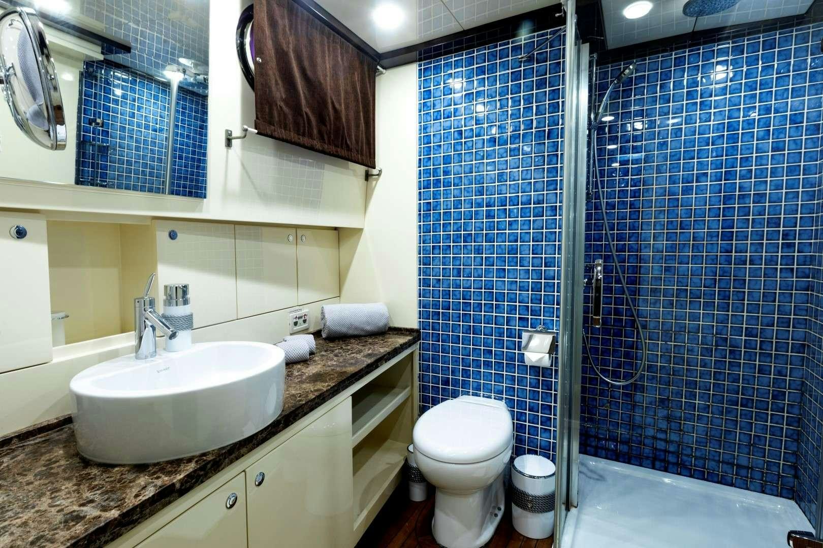 a bathroom with a sink and a toilet aboard SIYU Yacht for Charter