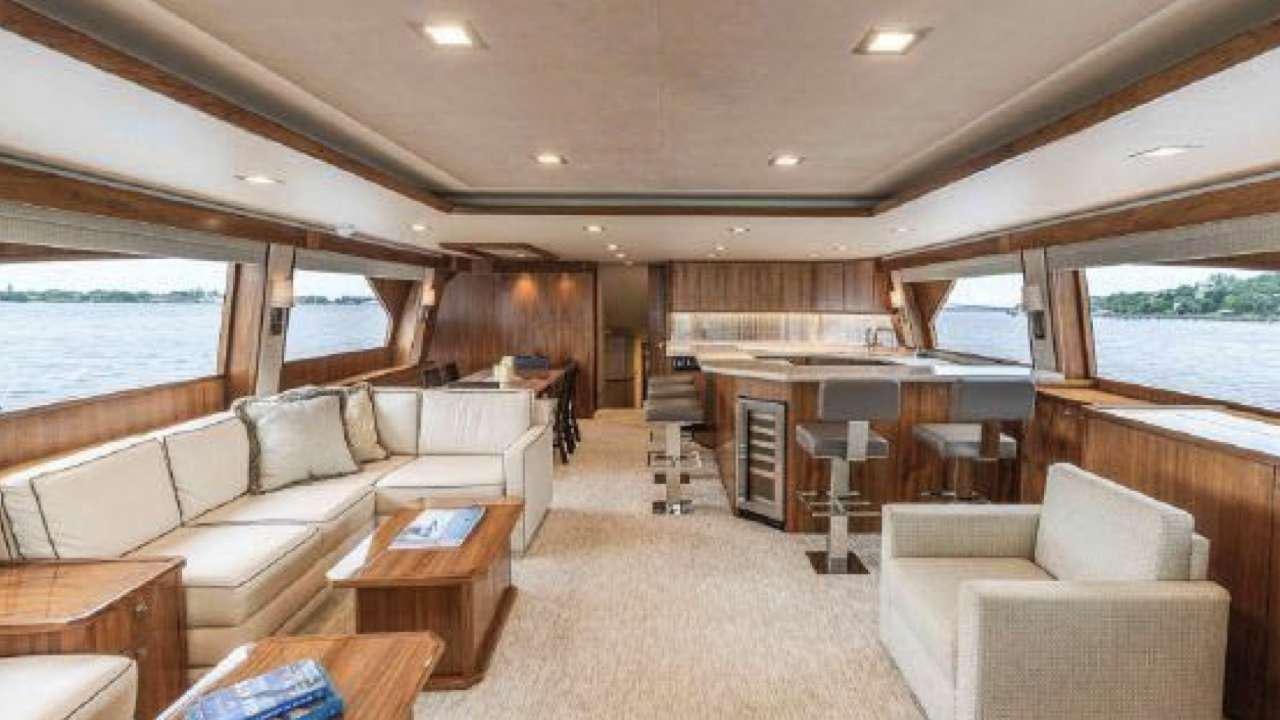 a living room with a couch and a table aboard TOUCHE Yacht for Charter