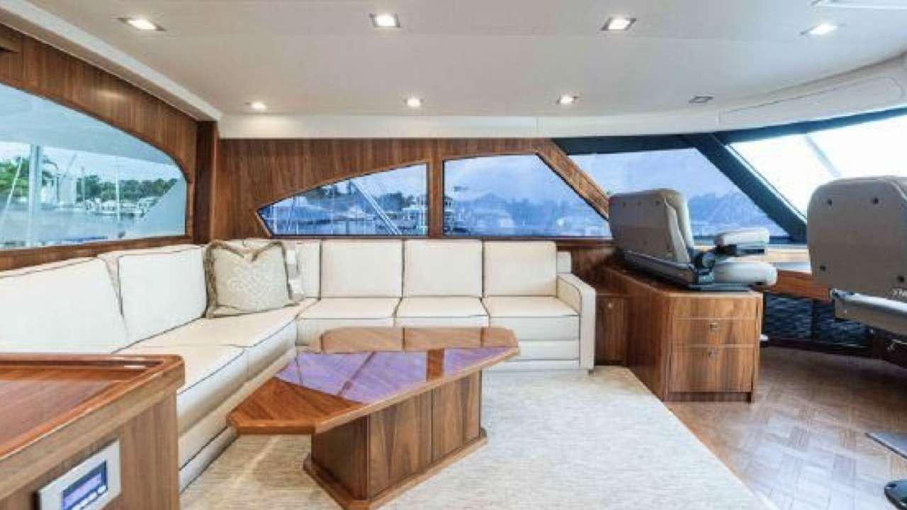 a living room with a couch and a tv aboard TOUCHE Yacht for Charter