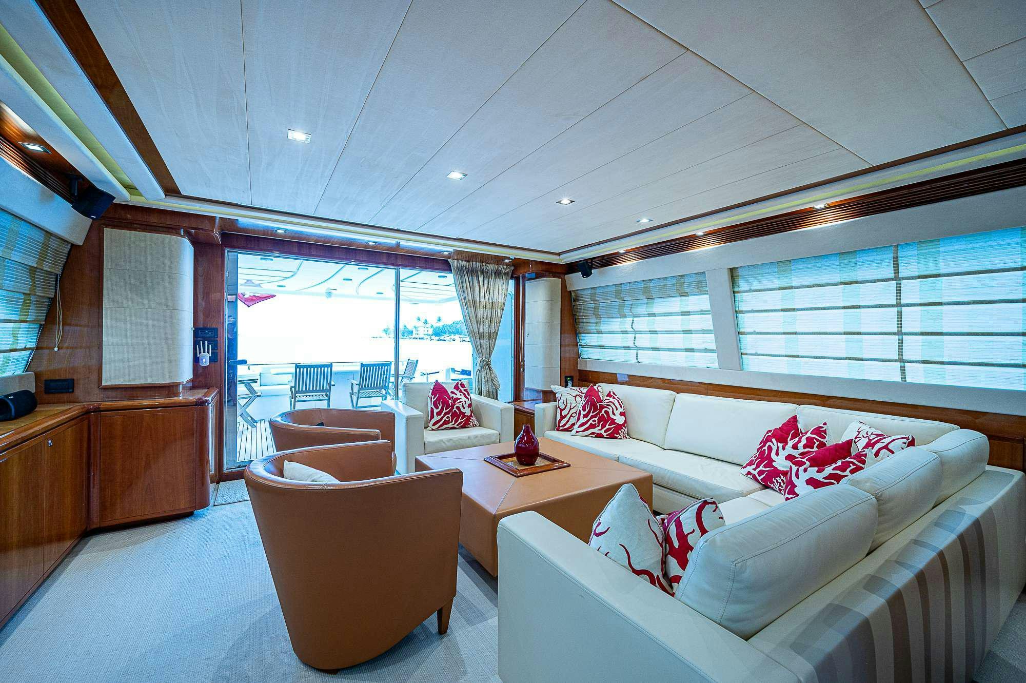a room with a couch and a table and chairs aboard LA PALOMA  Yacht for Charter
