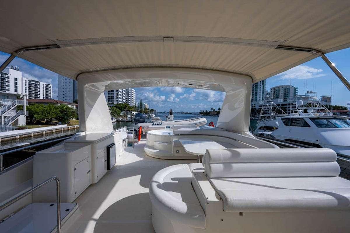 a room with a view of a city and a large window aboard LA PALOMA  Yacht for Charter