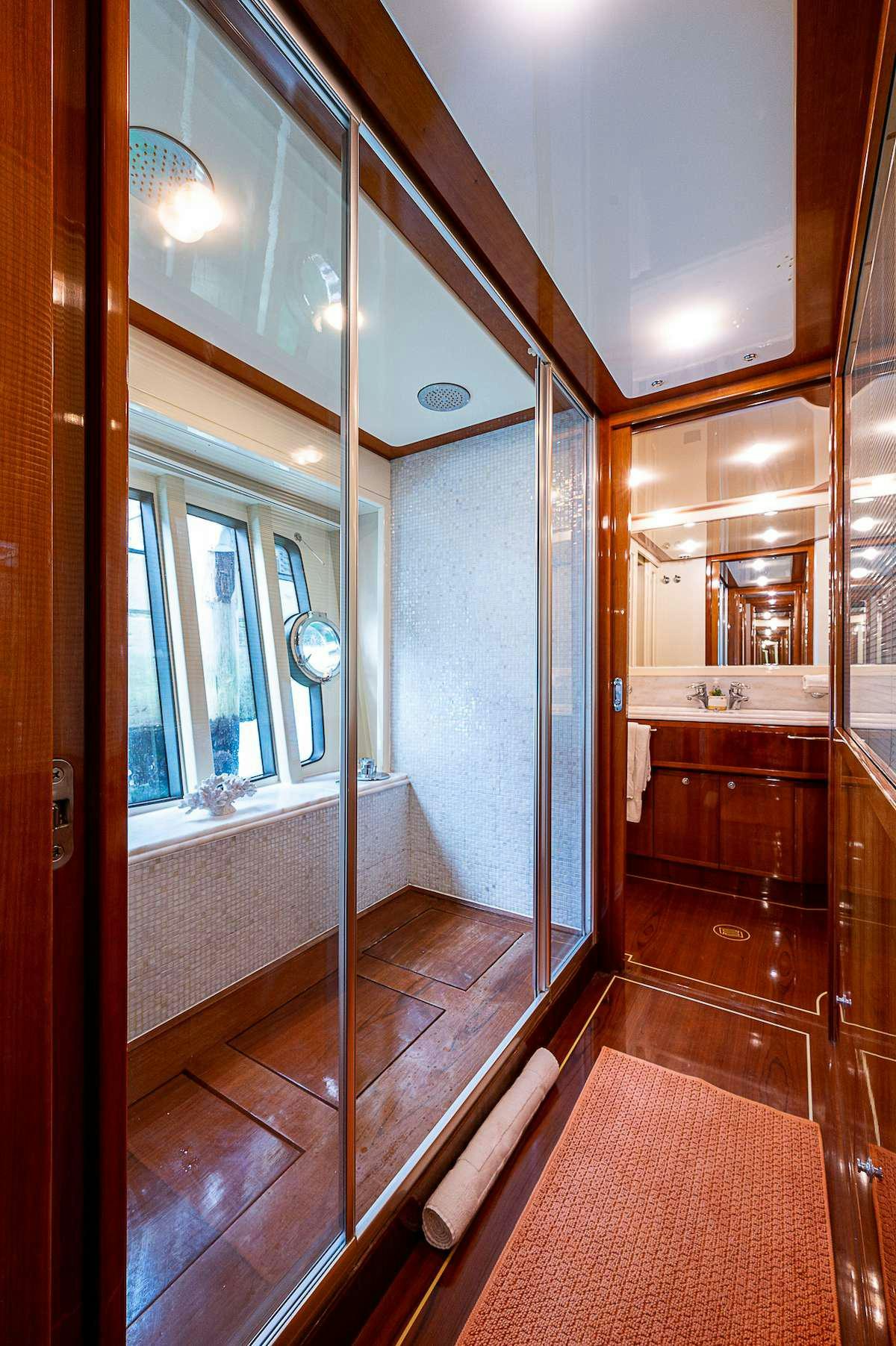 a bathroom with a wood floor aboard LA PALOMA  Yacht for Charter