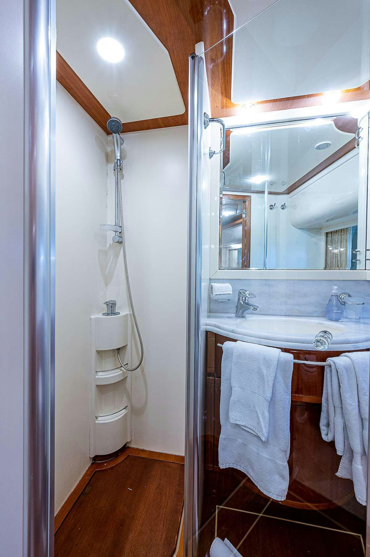a bathroom with a toilet and a sink aboard LA PALOMA  Yacht for Charter