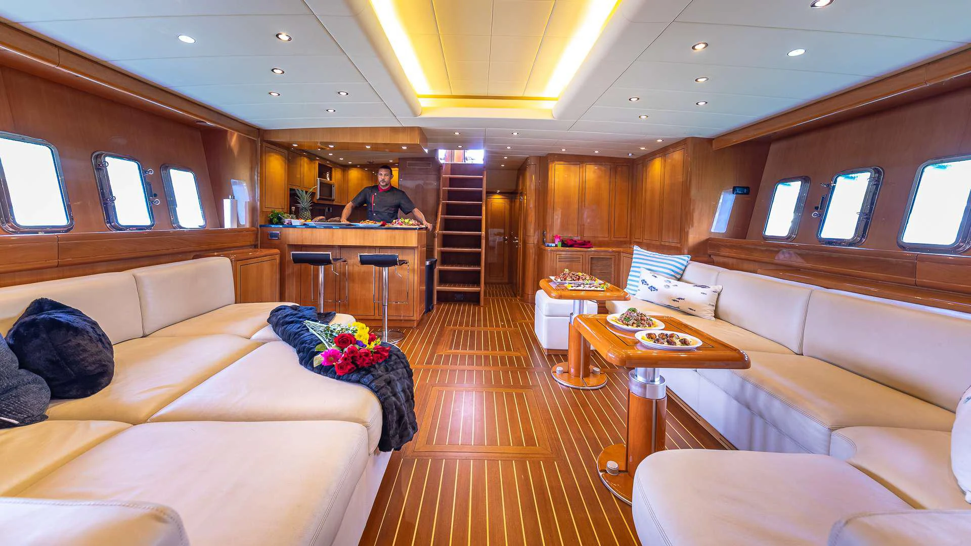 a person sitting in a room aboard HAPPY Yacht for Charter