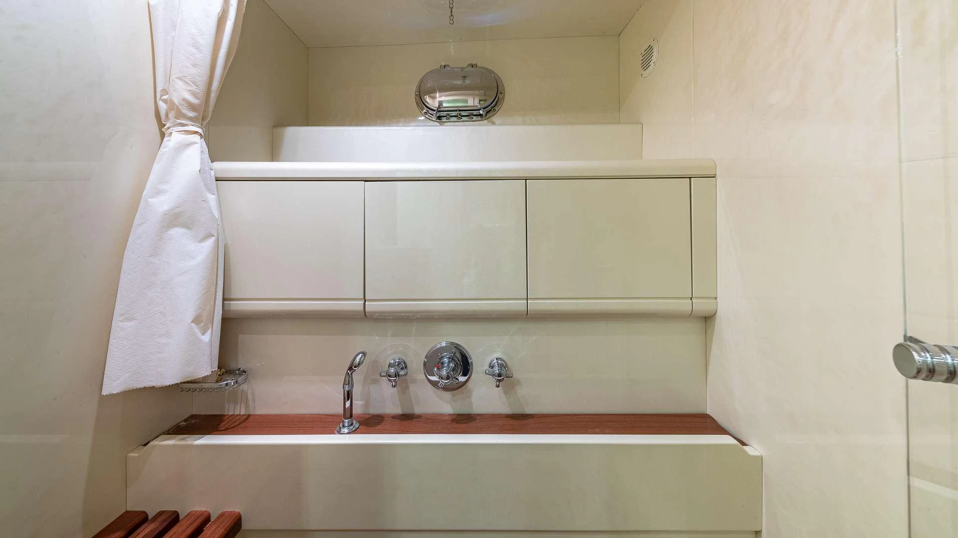 a bathroom with a sink and a towel on the wall aboard HAPPY Yacht for Charter