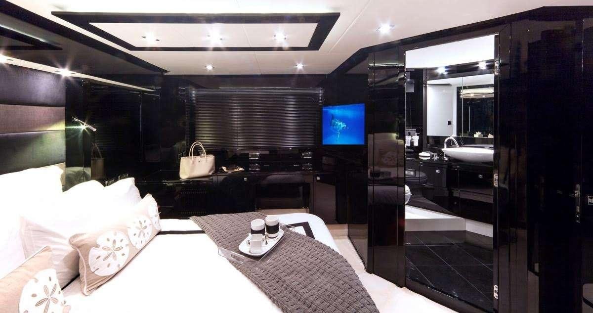 a room with a table and chairs aboard ALL IN Yacht for Charter