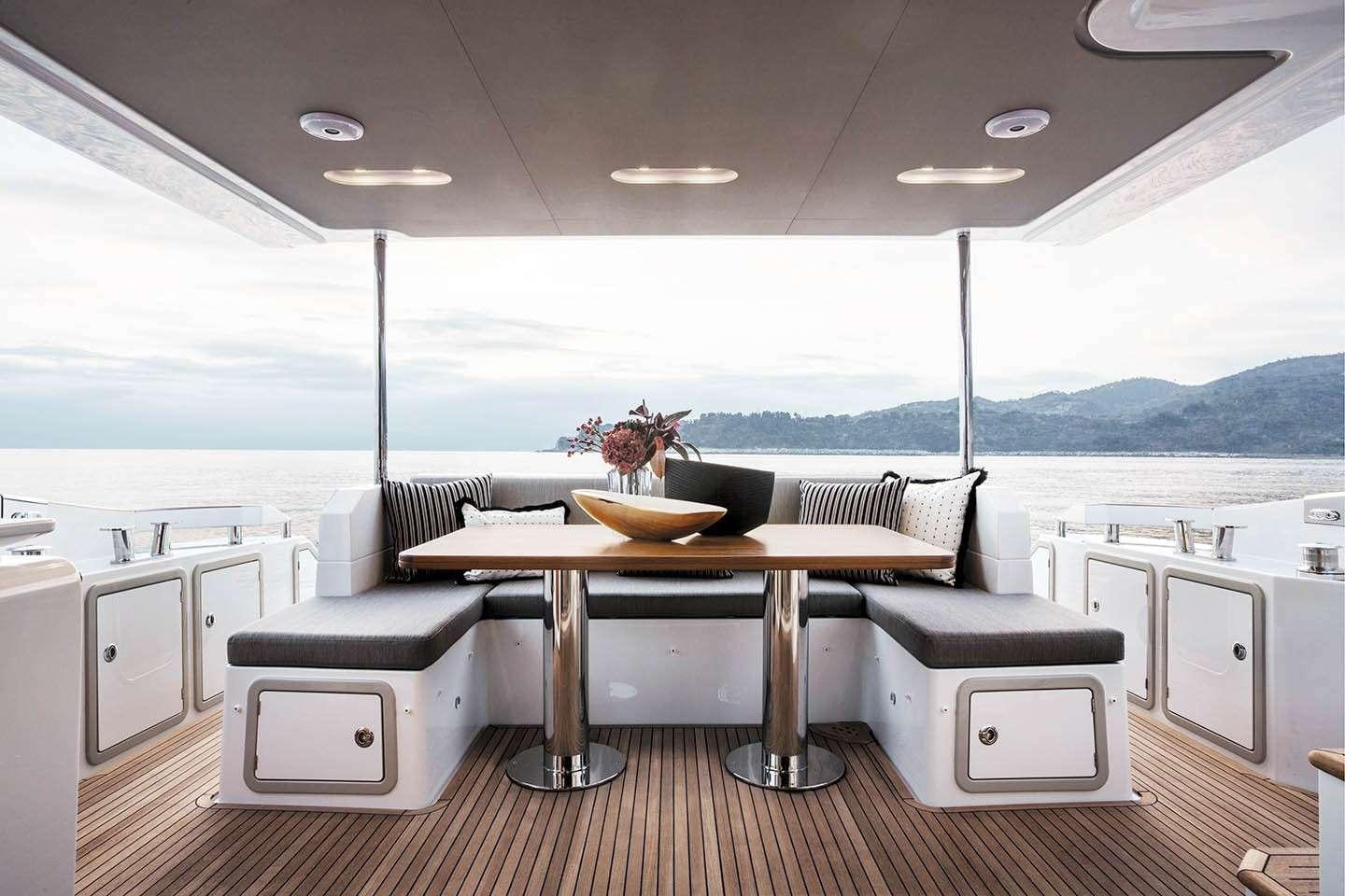 a modern kitchen with a large window aboard CERULEAN Yacht for Charter