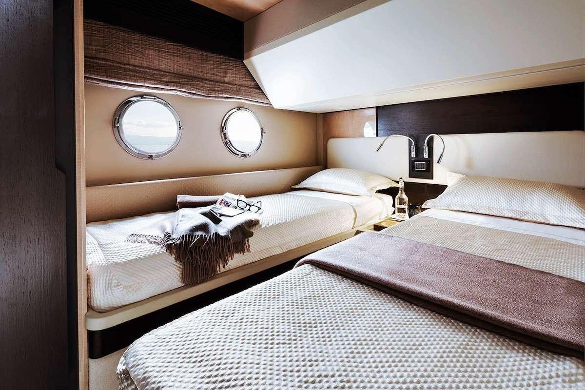 a room with three beds aboard CERULEAN Yacht for Charter