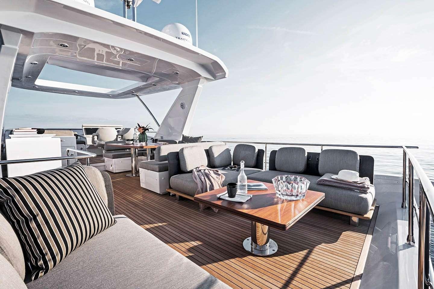 a living room with a couch and a table aboard MOZZ Yacht for Charter