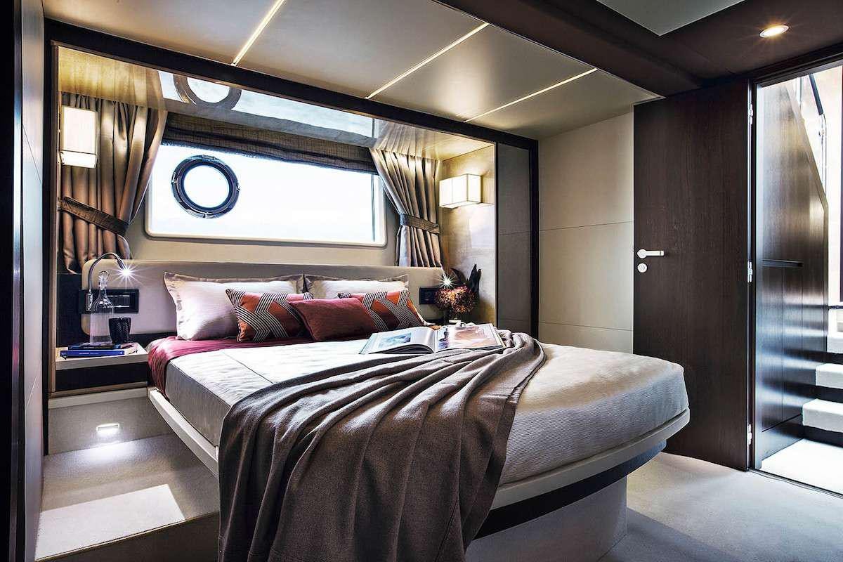 a bed in a room aboard MOZZ Yacht for Charter