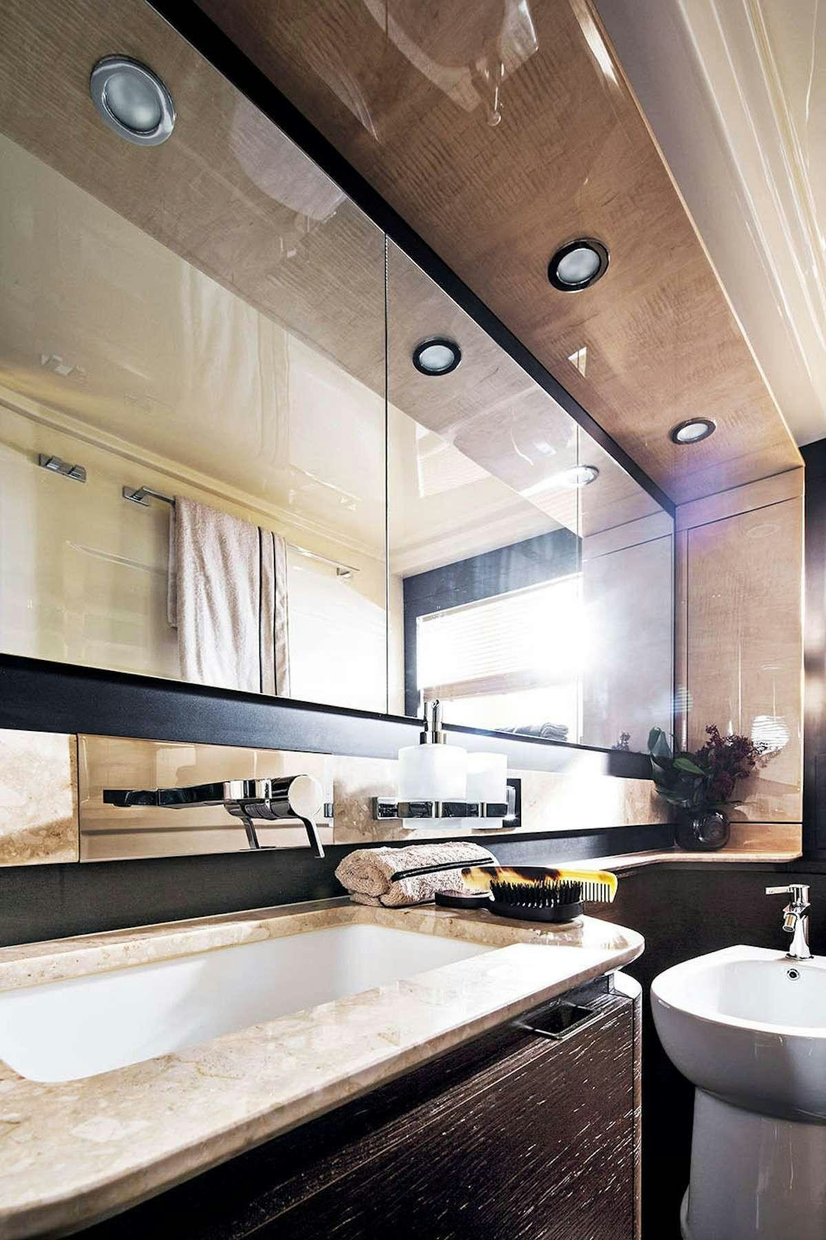 a bathroom with a large mirror aboard MOZZ Yacht for Charter
