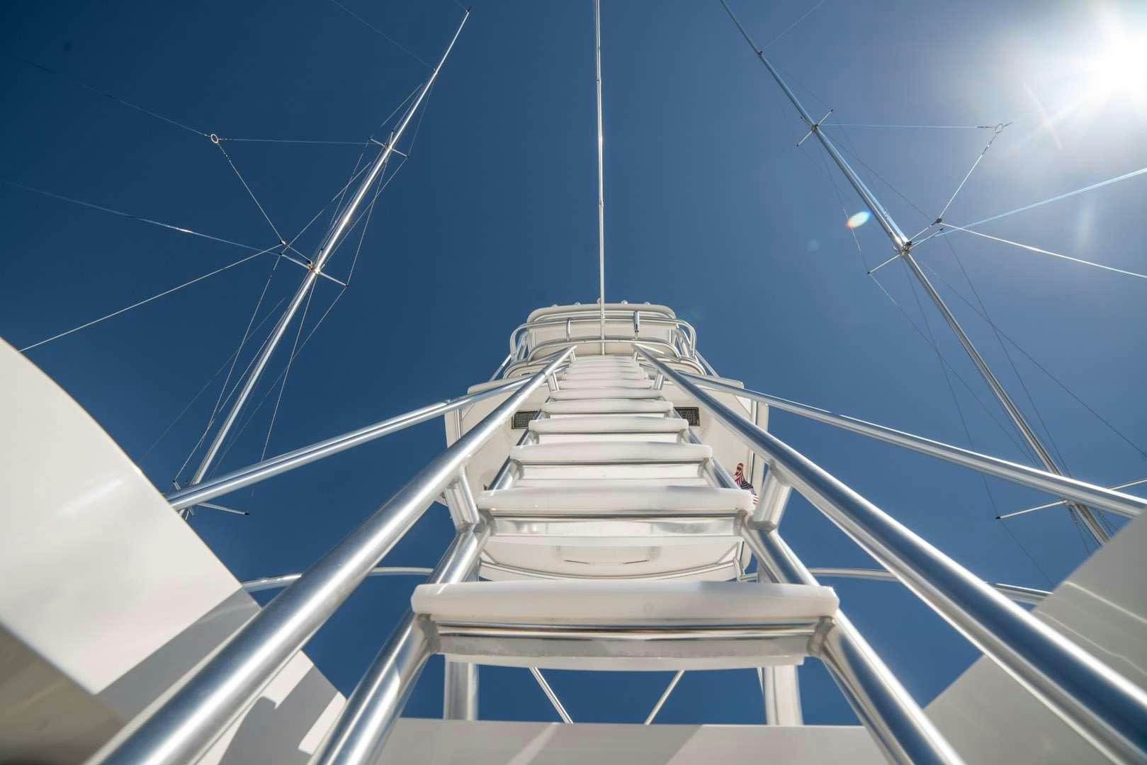 a white tower with a white railing aboard FA-LA-ME Yacht for Charter