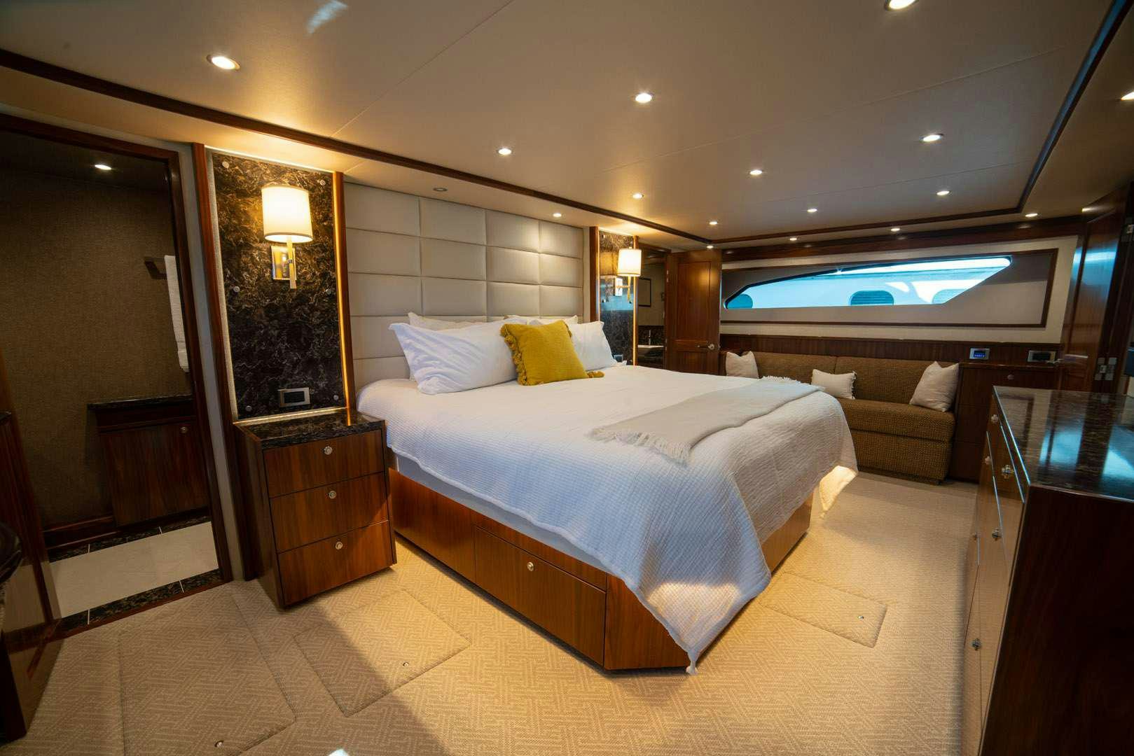 a hotel room with a bed and a tv aboard FA-LA-ME Yacht for Charter