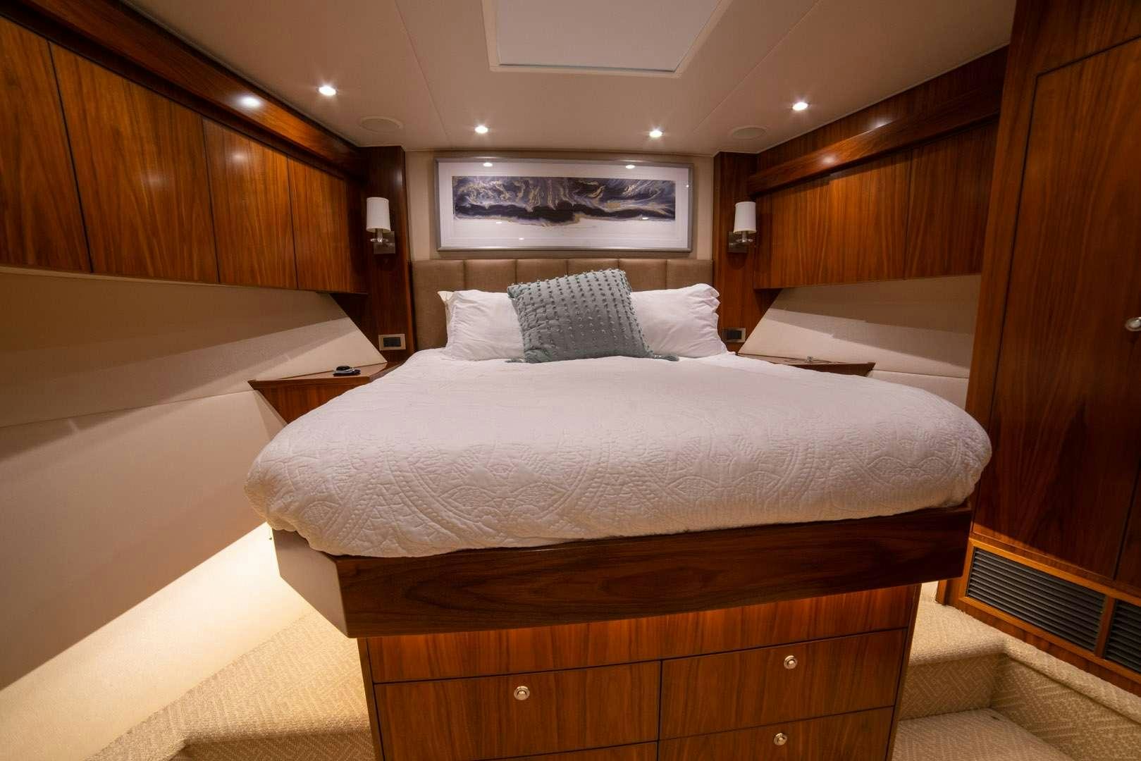 a bed with white sheets aboard FA-LA-ME Yacht for Charter