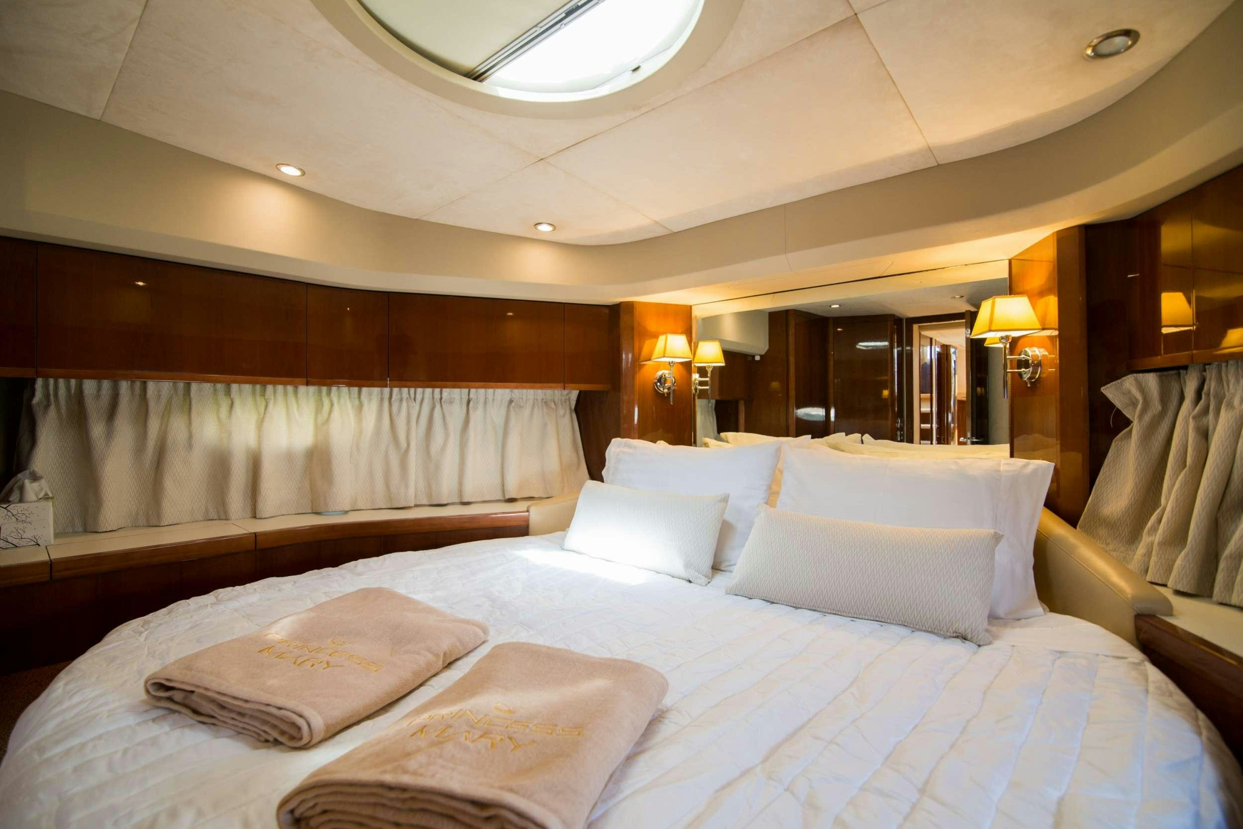 a hotel room with a bed aboard MOJO Yacht for Charter
