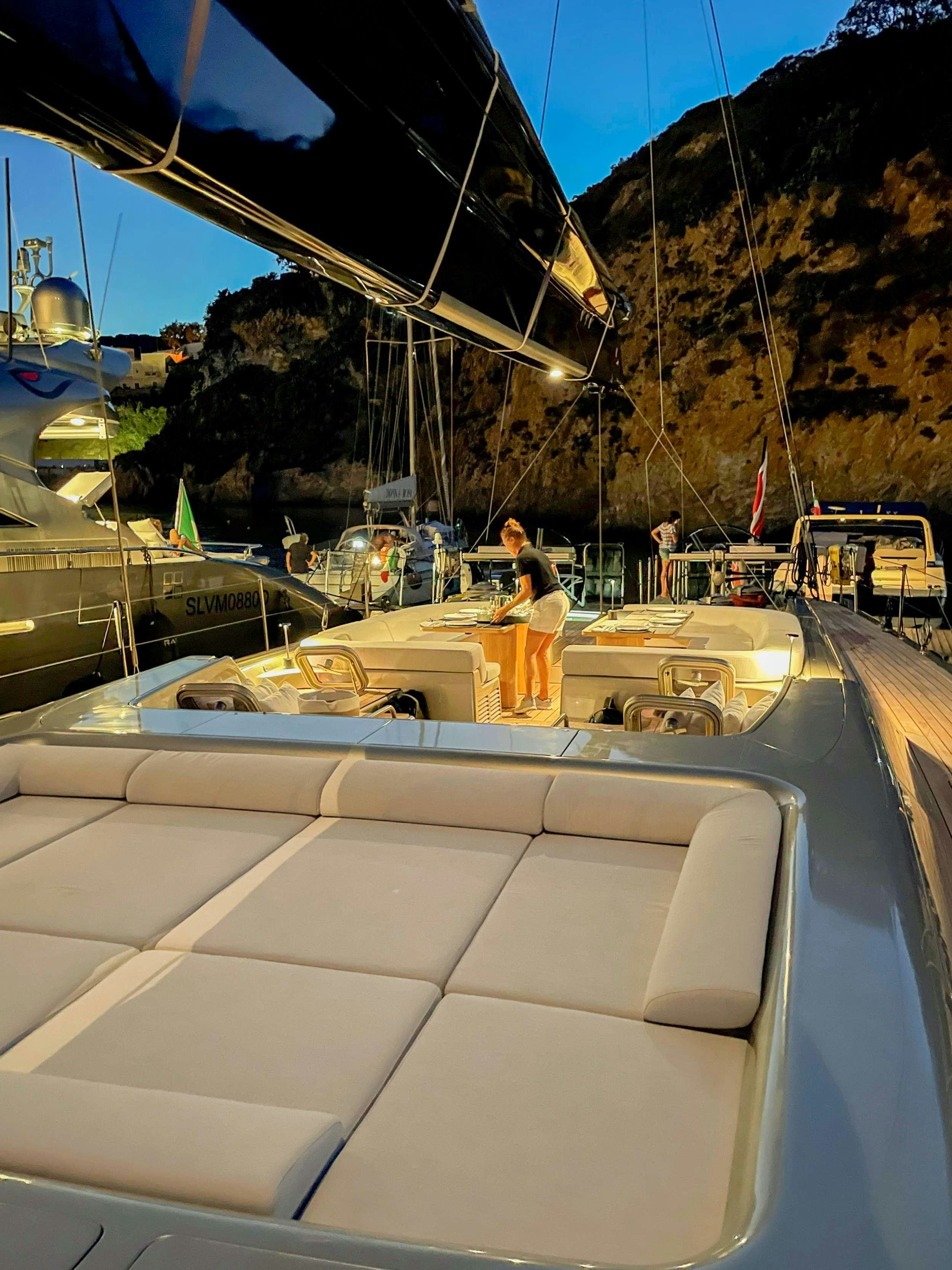 a person standing on a boat aboard RUNNING ON FAITH Yacht for Charter