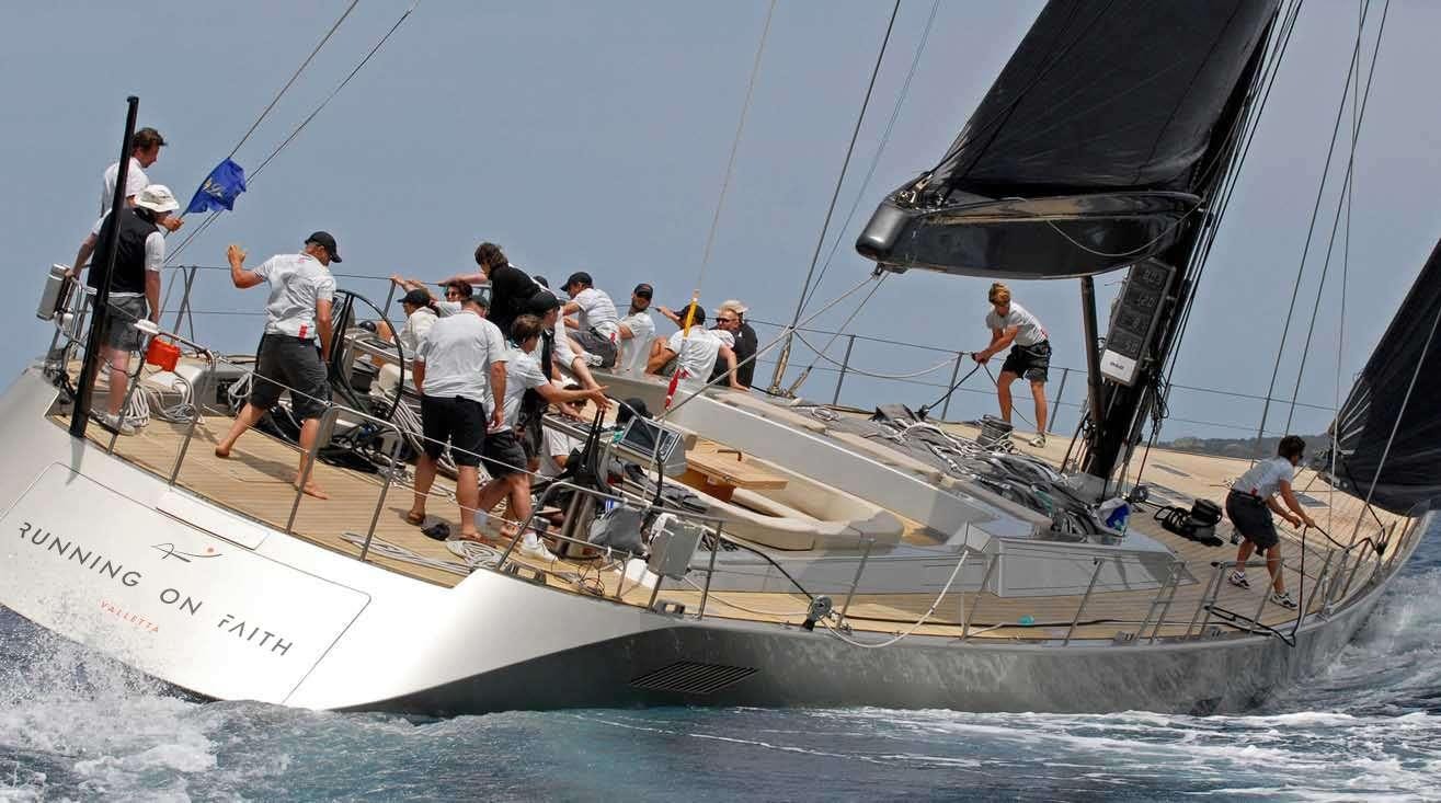a group of people on a boat aboard RUNNING ON FAITH Yacht for Charter